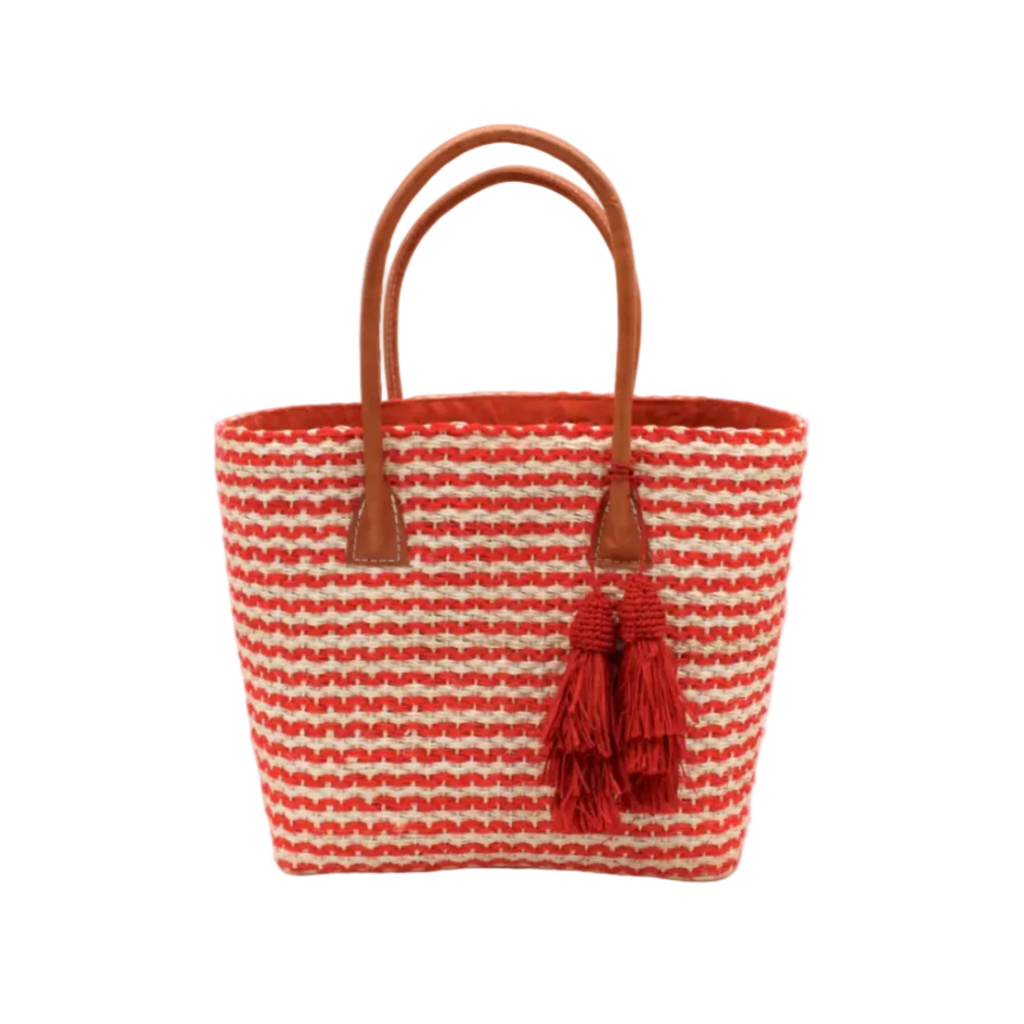 Cancun Small Sisal Basket Bag with Tassel Charm handmade natural sisal fibers woven into even width horizontal bands of coral orange and natural straw color that create a pinstripe pattern with matching knotted raffia tufts tassel charm embellishment and leather handles beach bag - Shebobo