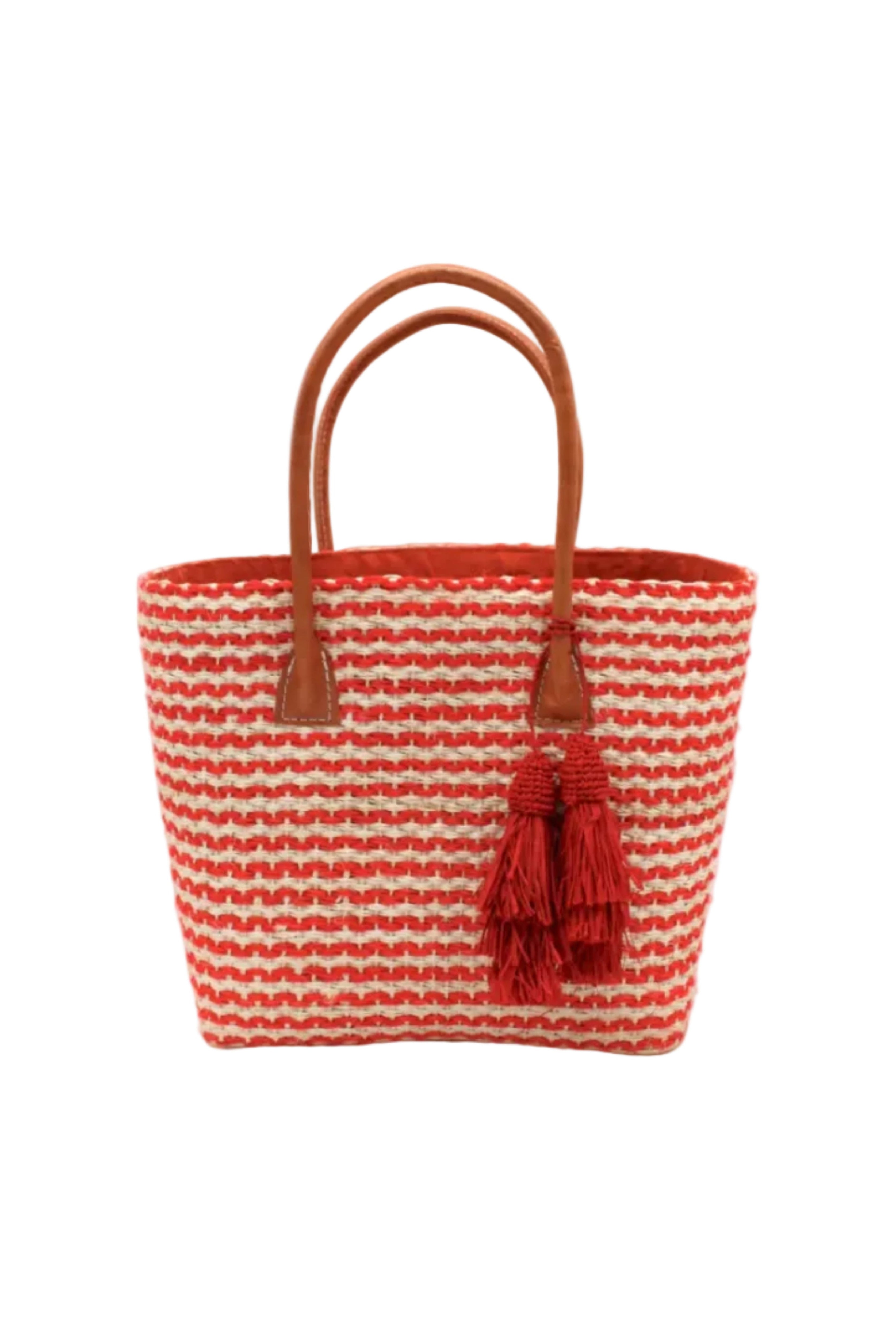 Cancun Small Sisal Basket Bag with Tassel Charm handmade natural sisal fibers woven into even width horizontal bands of coral orange and natural straw color that create a pinstripe pattern with matching knotted raffia tufts tassel charm embellishment and leather handles beach bag - Shebobo