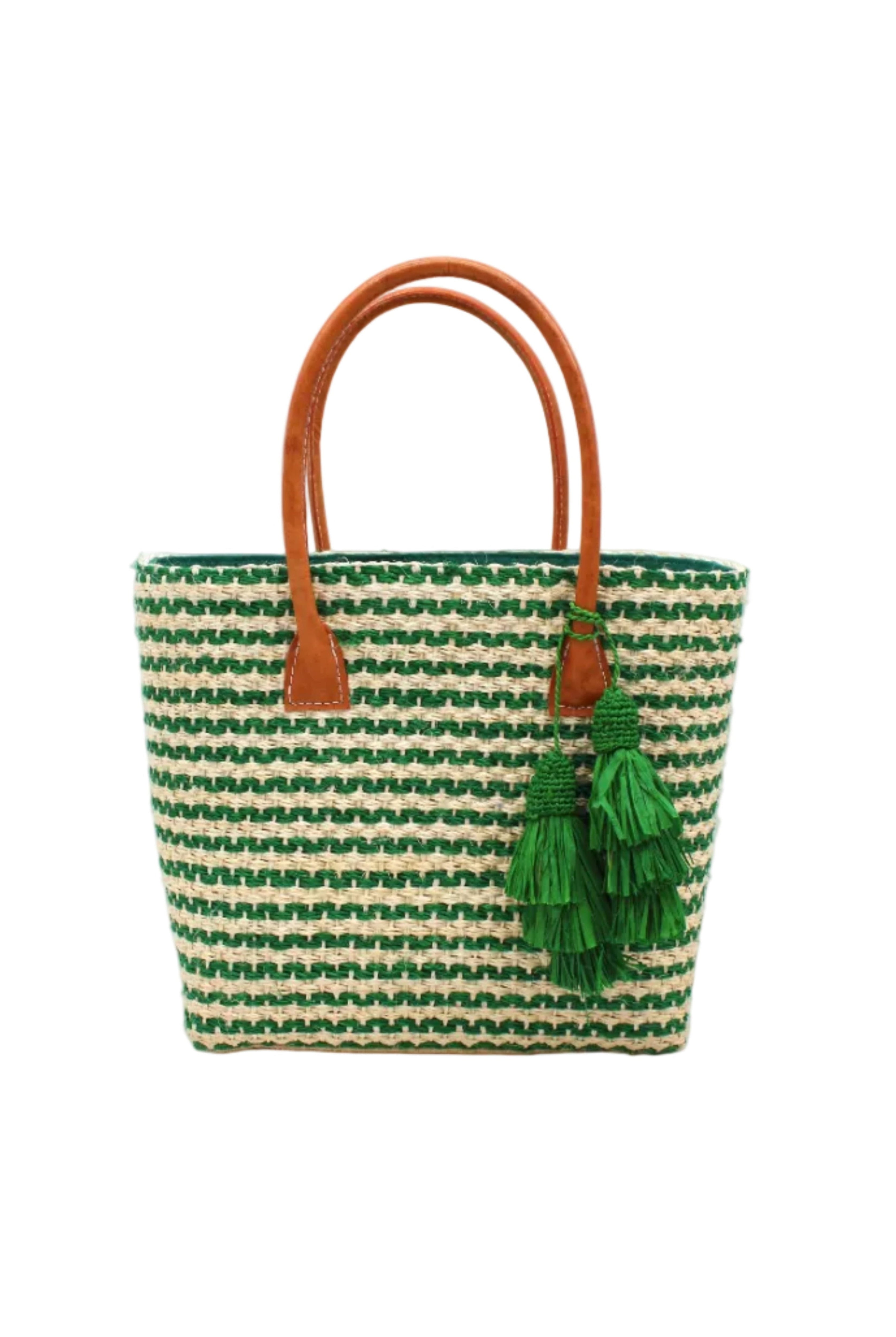 Cancun Small Sisal Basket Bag with Tassel Charm handmade natural sisal fibers woven into even width horizontal bands of deep green and natural straw color that create a pinstripe pattern with matching knotted raffia tufts tassel charm embellishment and leather handles beach bag - Shebobo