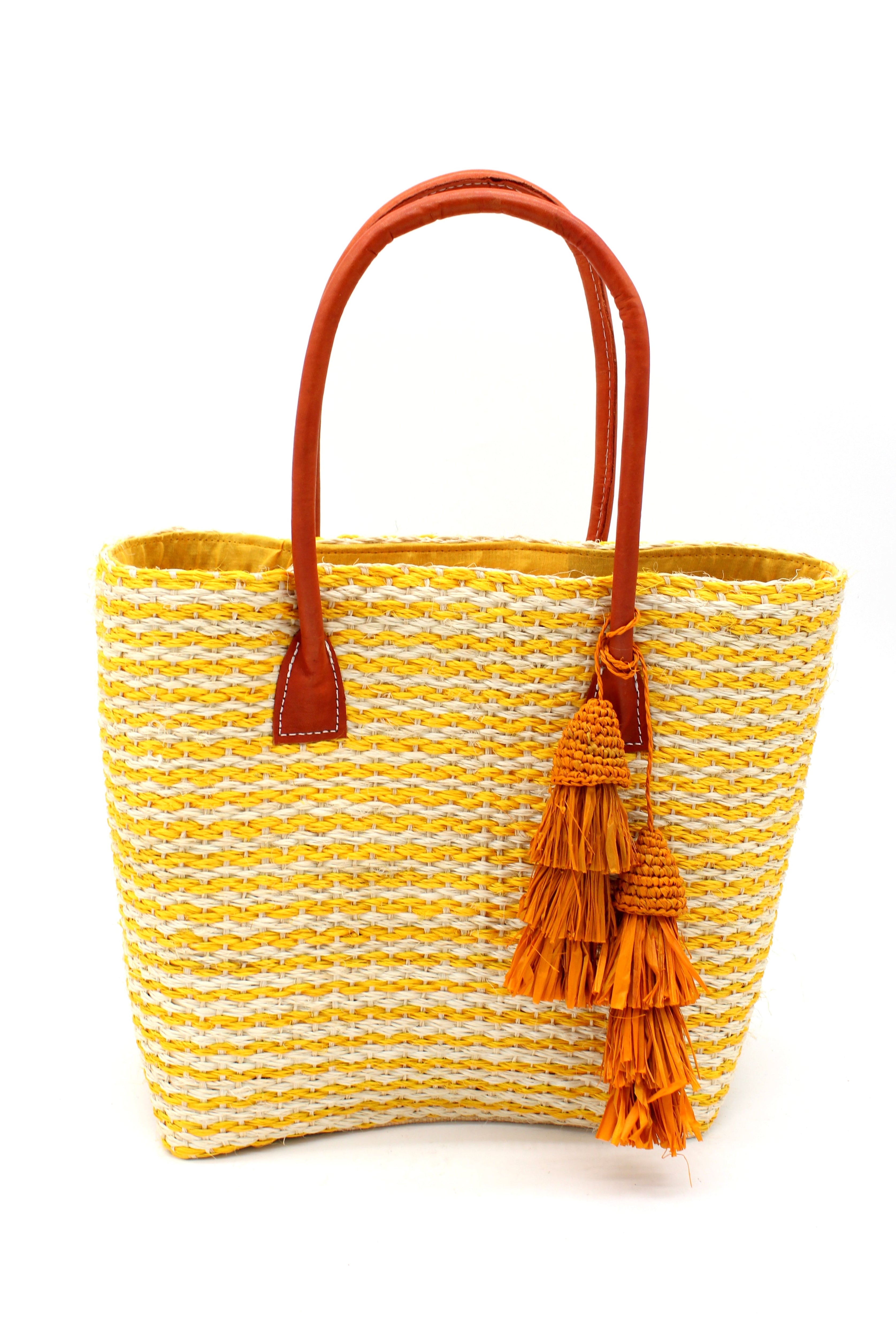 Cancun Small Sisal Basket Bag with Tassel Charm handmade natural sisal fibers woven into even width horizontal bands of saffron yellow and natural straw color that create a pinstripe pattern with matching knotted raffia tufts tassel charm embellishment and leather handles beach bag - Shebob
