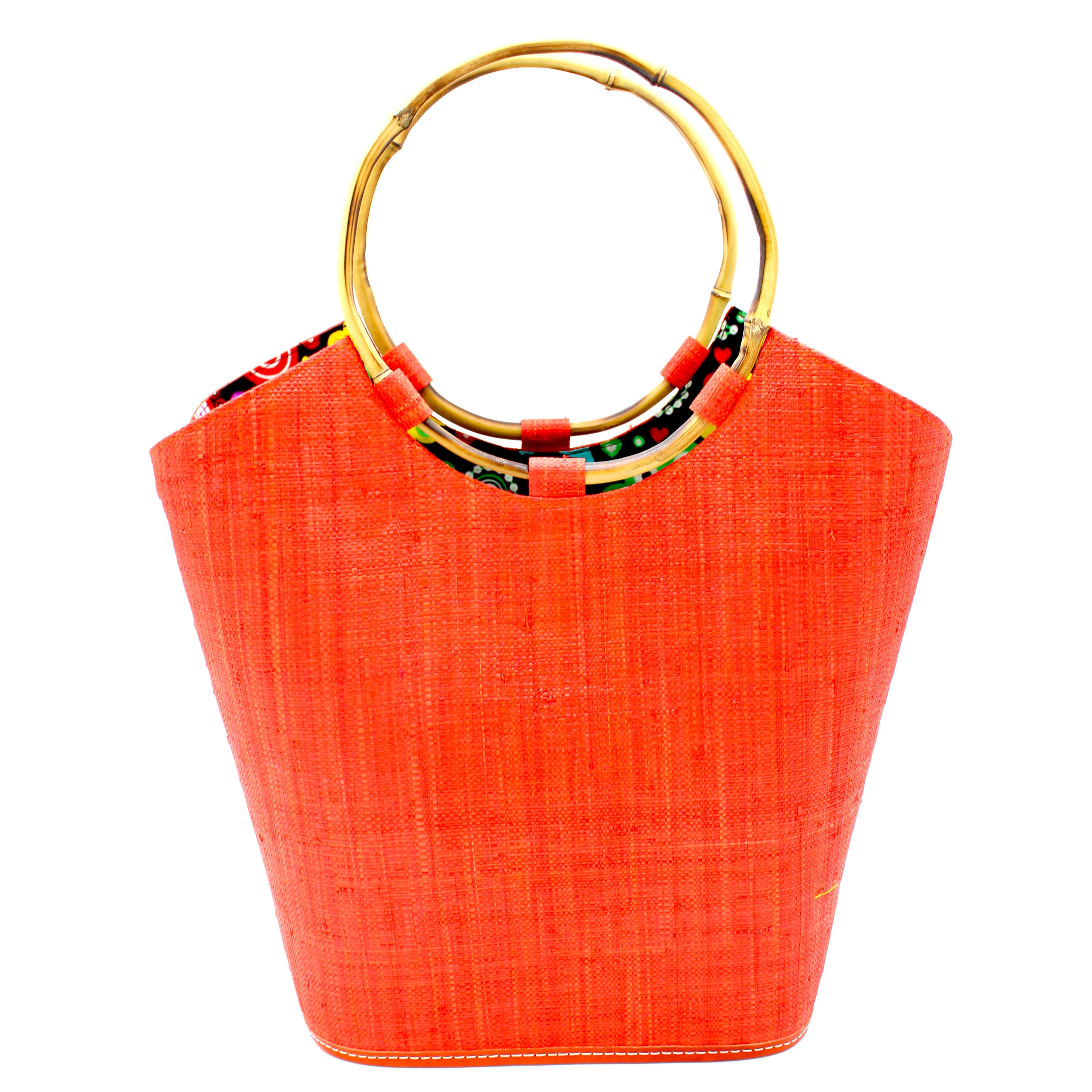 Carmen Coral Straw Bucket Bag with Bamboo Handles handmade loomed raffia in a solid hue of coral orange/red with assorted African print fabric liner handbag - Shebobo