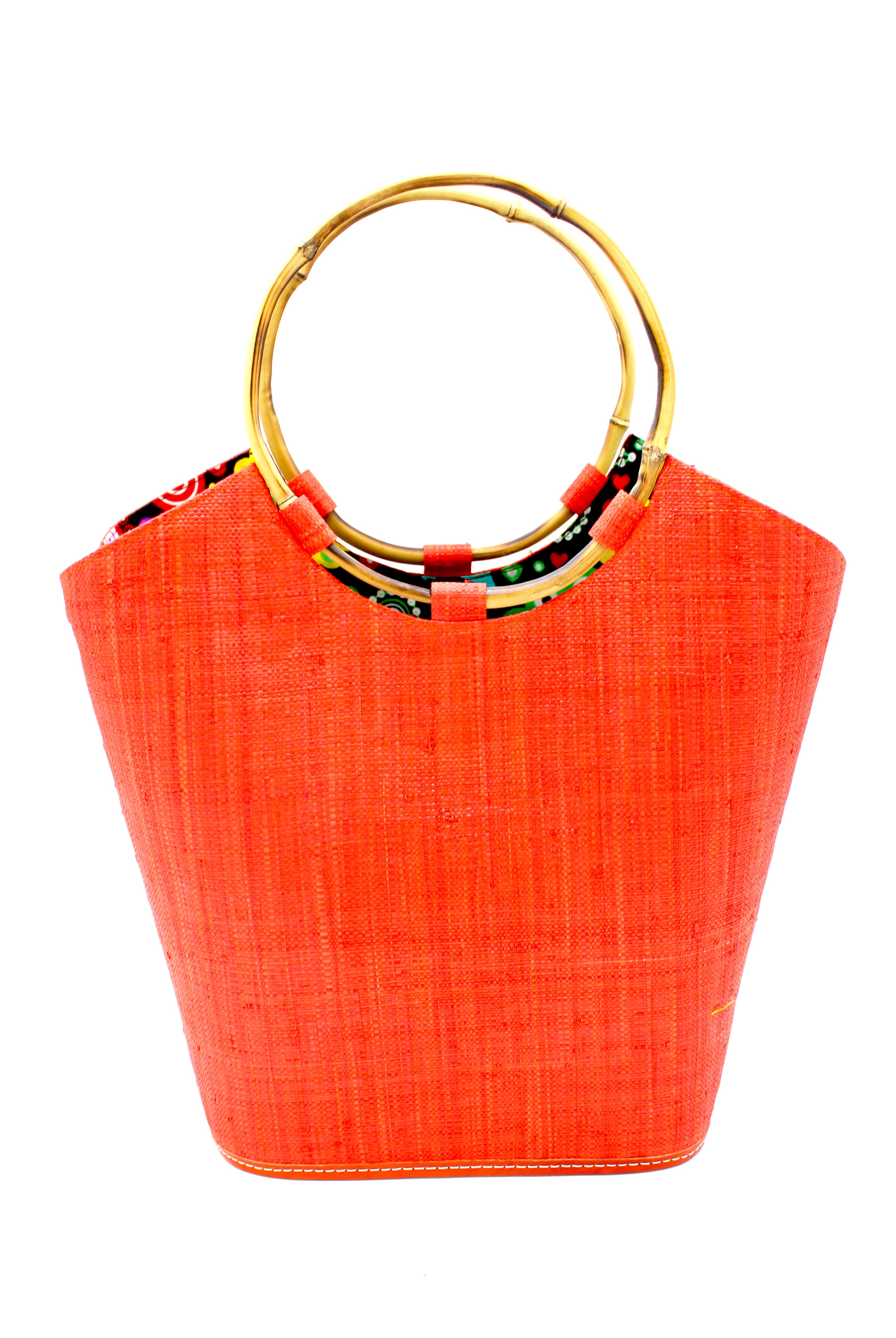 Carmen Coral Straw Bucket Bag with Bamboo Handles handmade loomed raffia in a solid hue of coral orange/red with assorted African print fabric liner handbag - Shebobo