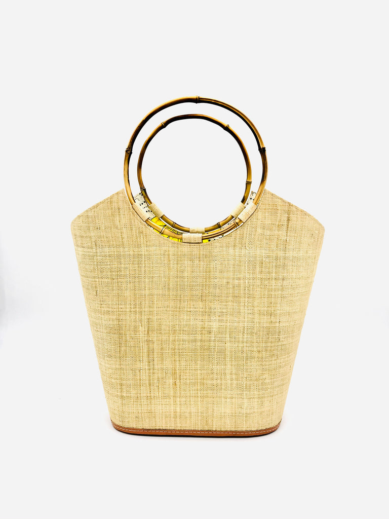 Carmen Natural Straw Bucket Bag with Bamboo Handles handmade loomed raffia in a solid hue of natural straw color with assorted African print fabric liner handbag - Shebobo
