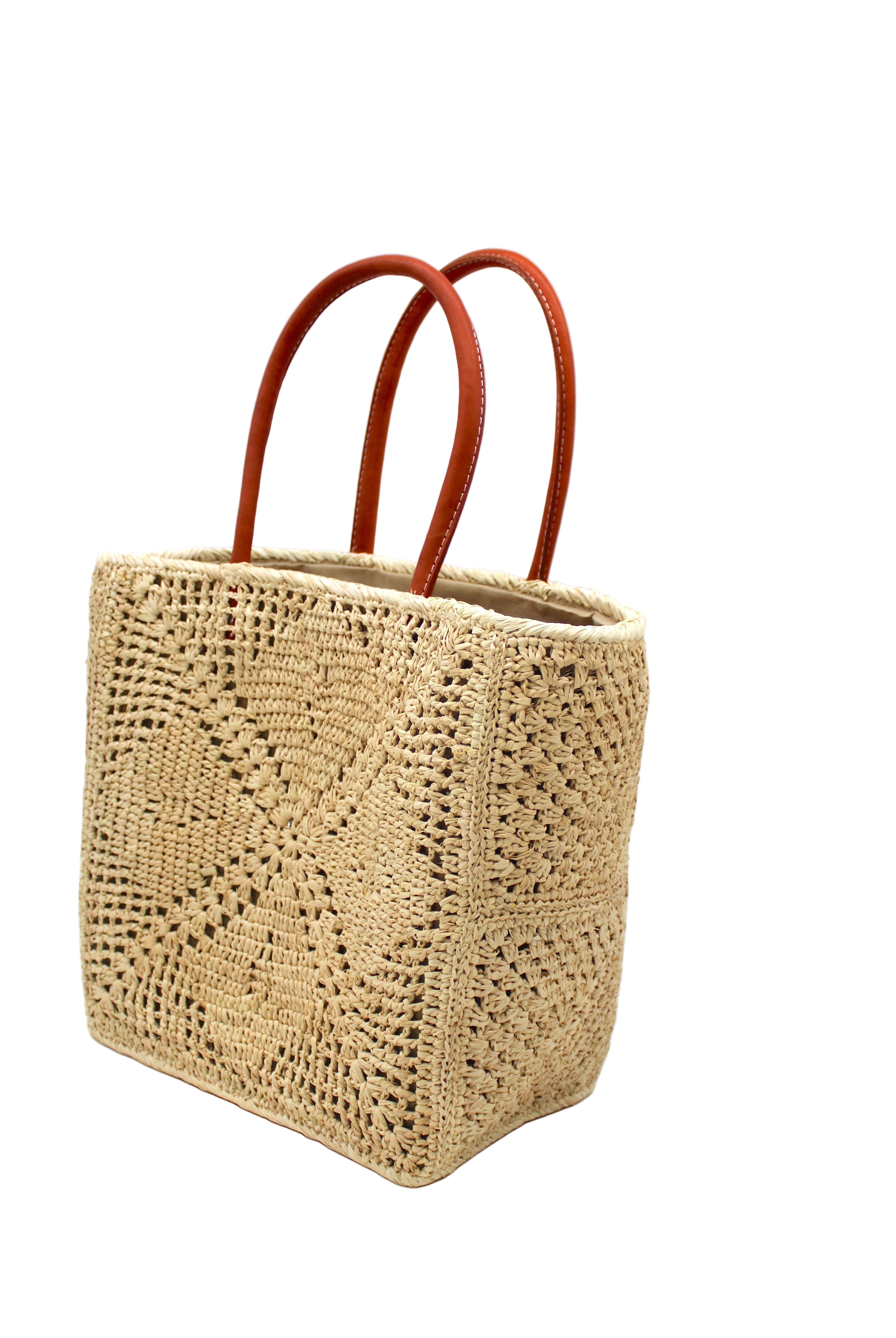 Side view Cheval Lace Square Pattern Crochet Straw Basket Bag handmade from natural raffia palm fiber in a lace square geometric diamond pattern with triangle detailing textile in a natural straw color with leather handles handbag purse beach bag tote- Shebobo
