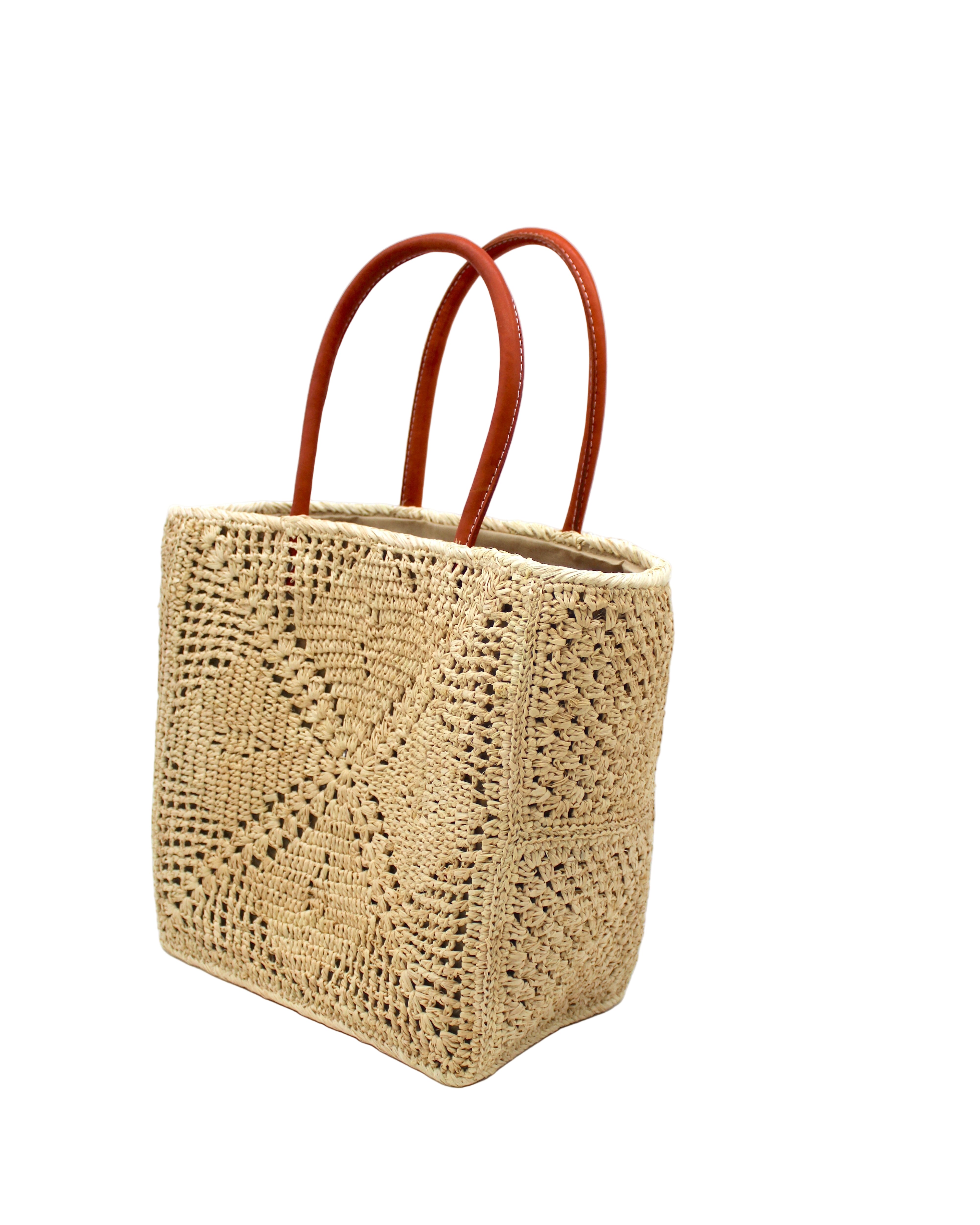 Side view Cheval Lace Square Pattern Crochet Straw Basket Bag handmade from natural raffia palm fiber in a lace square geometric diamond pattern with triangle detailing textile in a natural straw color with leather handles handbag purse beach bag tote- Shebobo