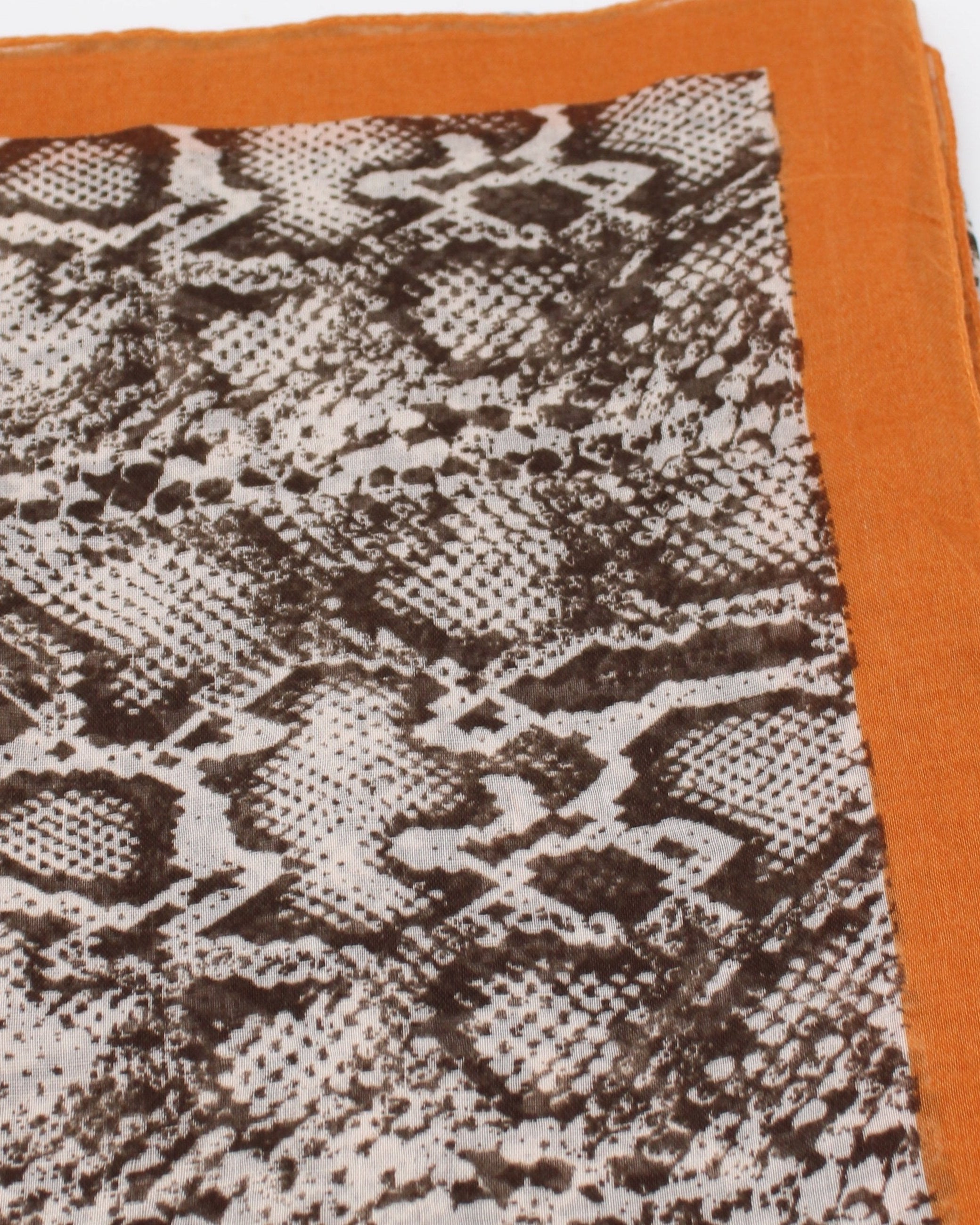 Detail view of pattern Cleo Snake Print Scarf Wrap Coral Orange, Black, and White Multicolor Snake Skin Patterned Scarf with colored edge - Shebobo
