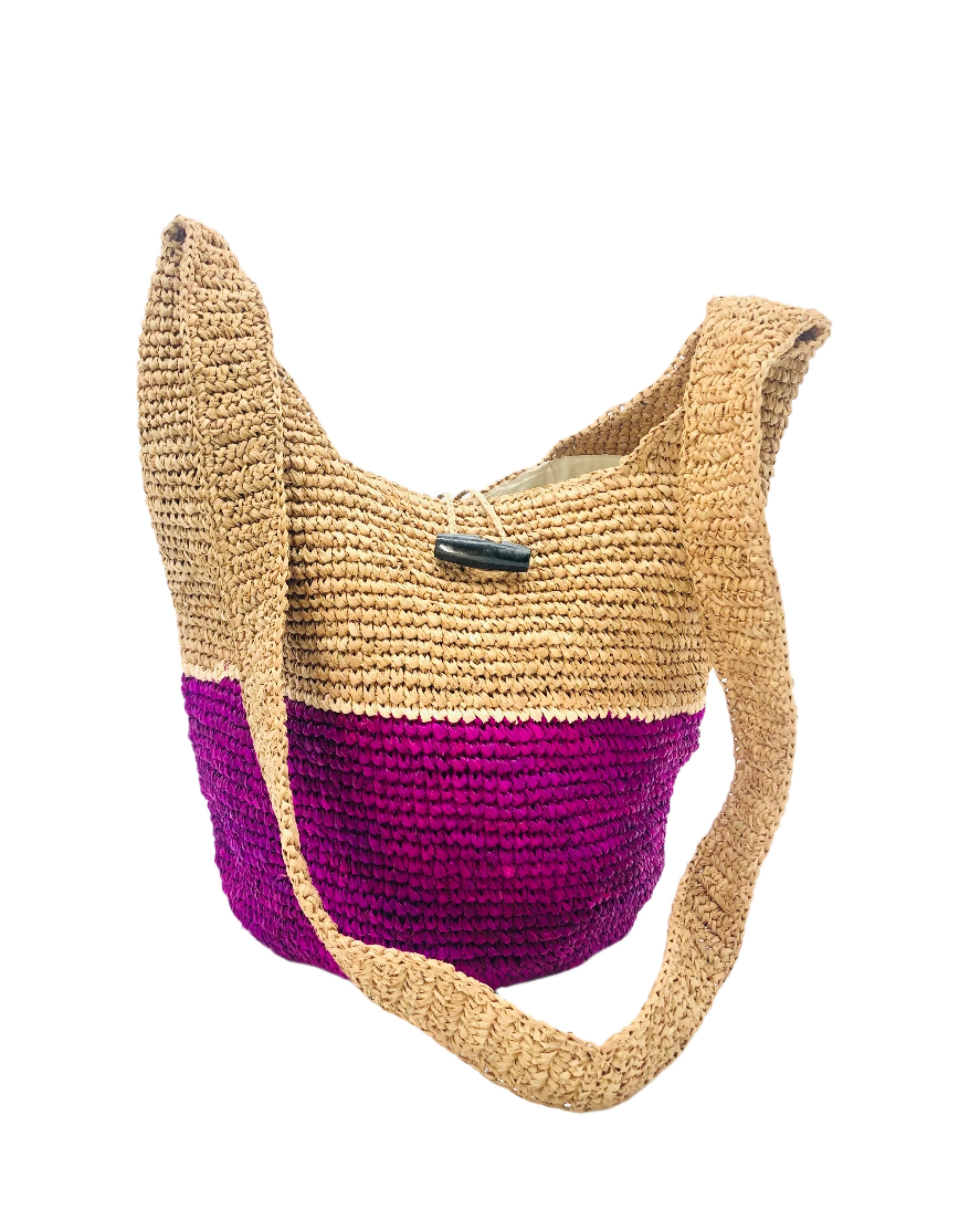 Coronado Two Tone Crochet Crossbody Bag handmade with interior liner, horn button and loop closure raffia purse orchid purple bottom, with narrow natural straw color horizontal stripe separating light brown/tea colored top & shoulder strap - Shebobo