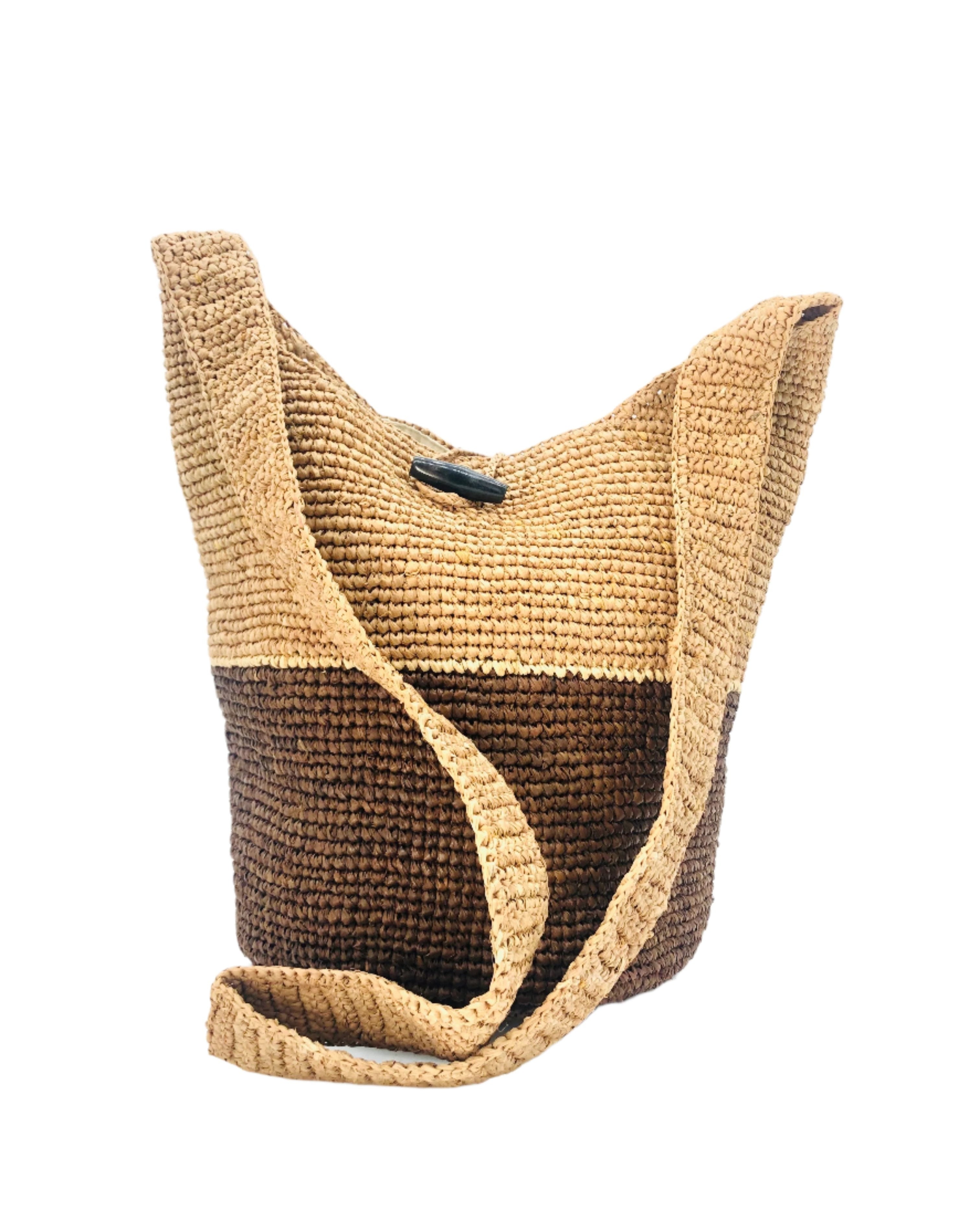 Coronado Two Tone Crochet Crossbody Bag handmade with interior liner, horn button and loop closure raffia purse cinnamon/tobacco/dark brown bottom, with narrow natural straw color horizontal stripe separating light brown/tea colored top & shoulder strap - Shebobo