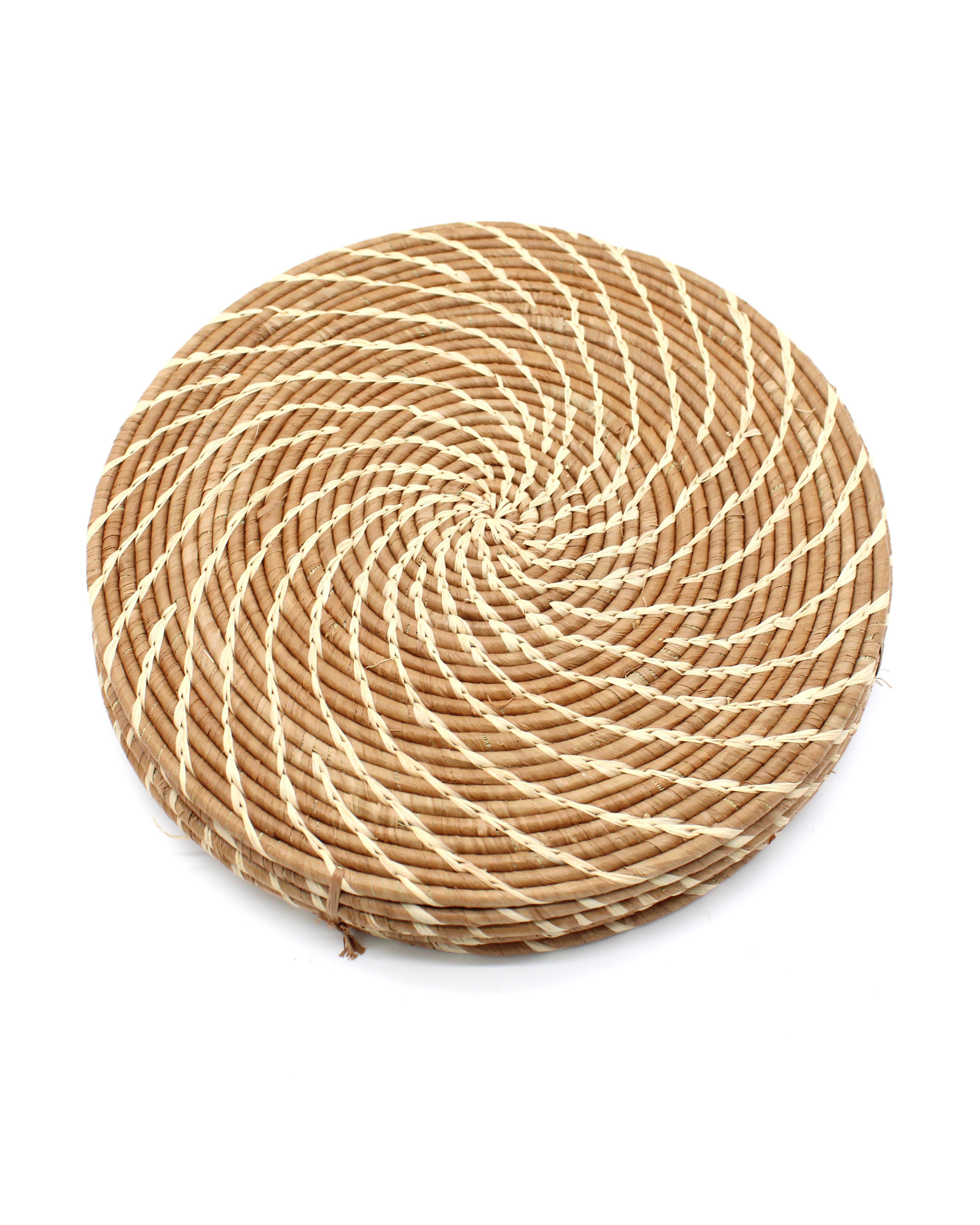 Dabu Round Two Tone Swirl Raffia Straw Coasters & Placemats Set of 6 handmade natural raffia palm fiber in a crochet loop disc technique creating concentric circular stripe pattern of texture in a solid hue of cinnamon/tobacco/brown with contrasting knotted spiral swirl weave in natural straw color sets of six placemats or coasters - Shebobo