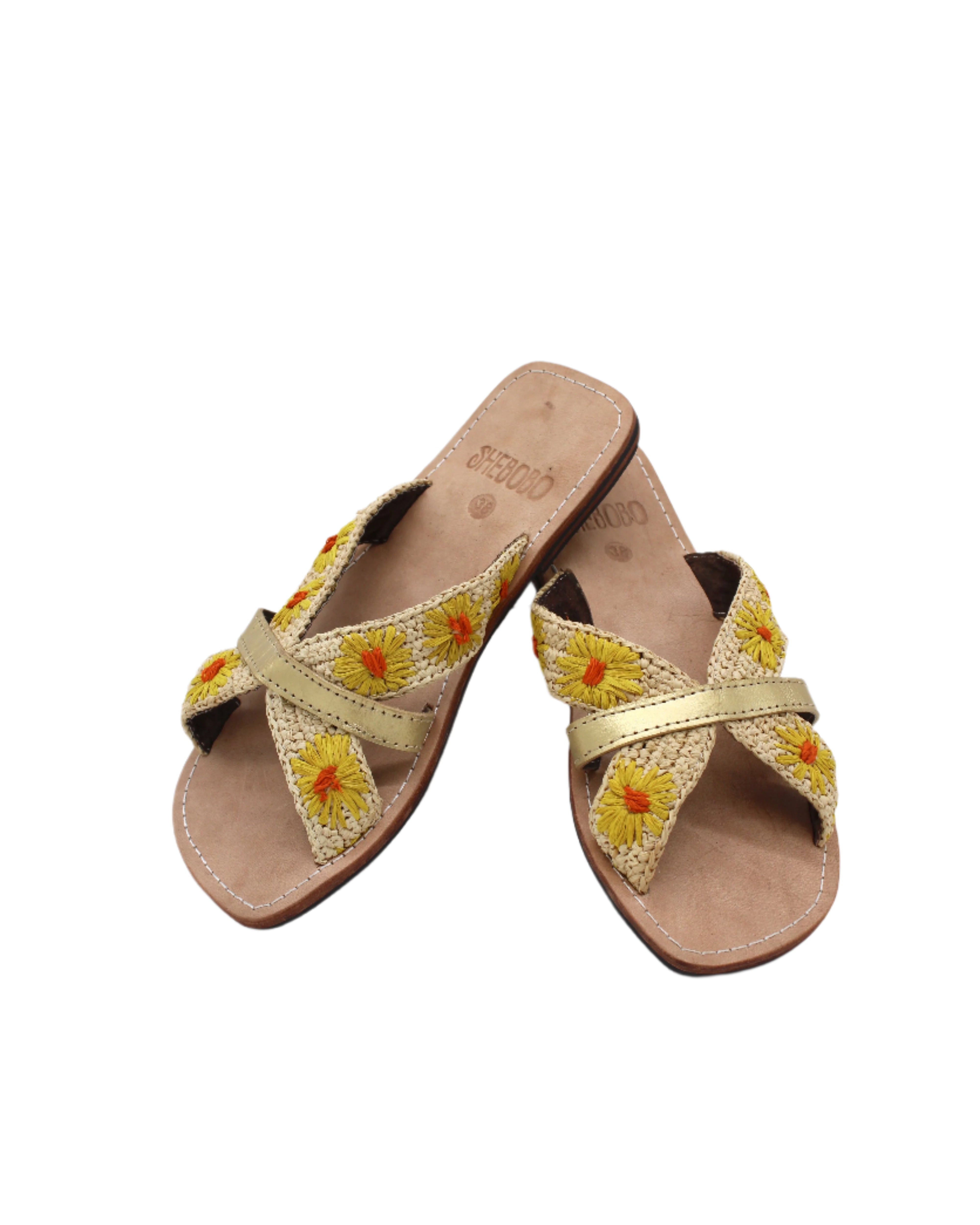 Daisy Crochet Straw & Leather Sandal with Flower Embroidery & Metallic Detailing handmade crochet natural raffia palm fiber in a solid hue of natural straw color in two bands with saffron yellow petals and coral orange/red centered embroidered flower pattern wrap around the top of the shoe with a band of metallic gold across the top summer sandals shoes - Shebobo