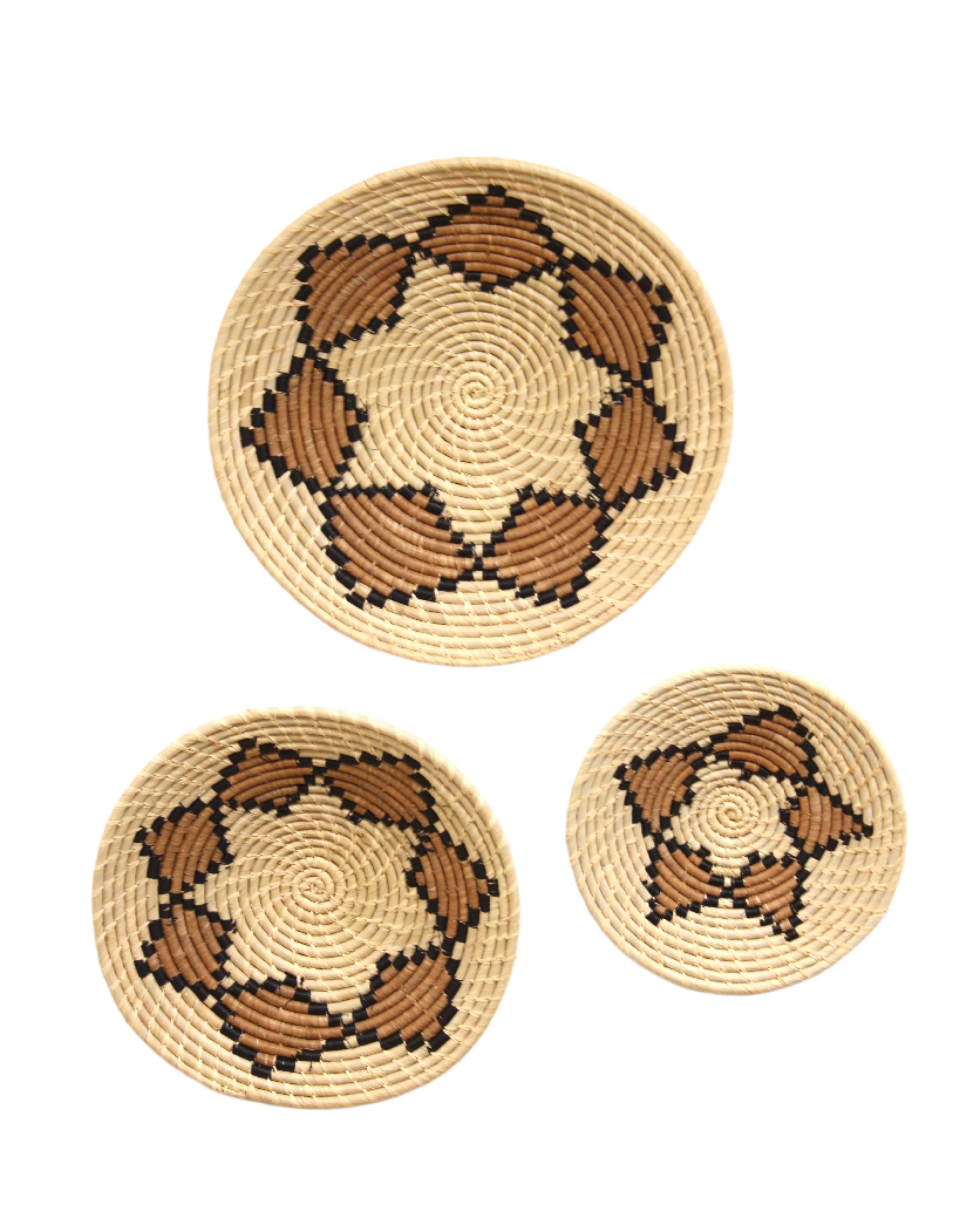 Dakarai Raffia Straw Wall Decor Display Basket Tray: Set of 3 handmade woven natural raffia palm fiber in a crochet loop technique concentric coiled circular pattern with double natural straw color, cinnamon/tobacco/brown, and black centered star flower pattern set of three sized flat bowl trays - Shebobo