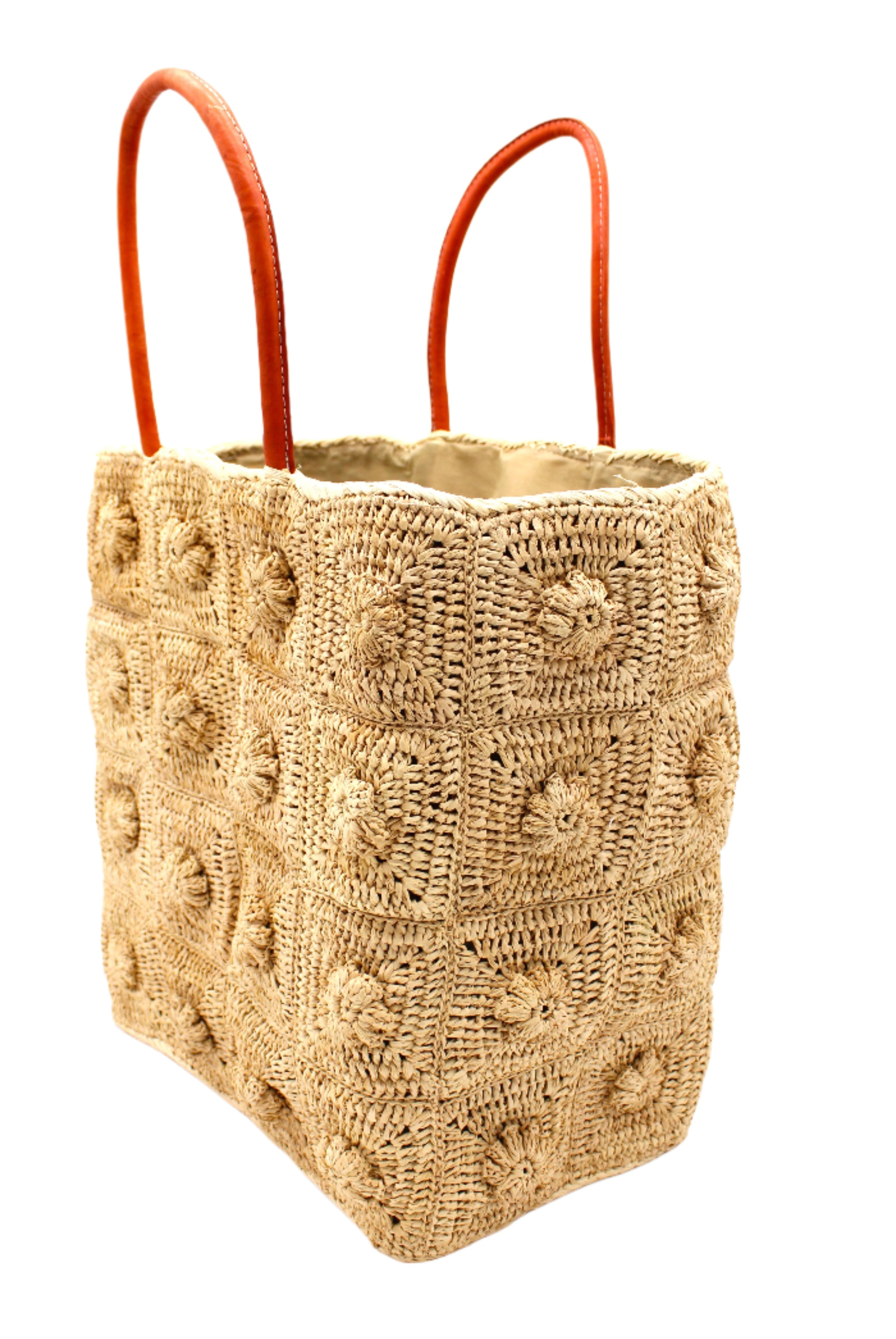 Side View Flower Power Natural Crochet Straw Basket Bag handmade from natural raffia palm fiber in a granny square geometric floral pattern with petite flower detailing per square, crochet textile in a natural straw color with leather handles handbag purse - Shebobo