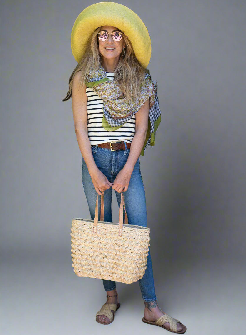 Model wearing French Country Floral and Gingham Scarf Wrap Green Multicolor Floral pattern inside a black and white checked gingham plaid with colored edge - Shebobo (with 7" Packable Butter Straw Sun Hat, Boucle Basket Bag, and Lizzie Sandal)