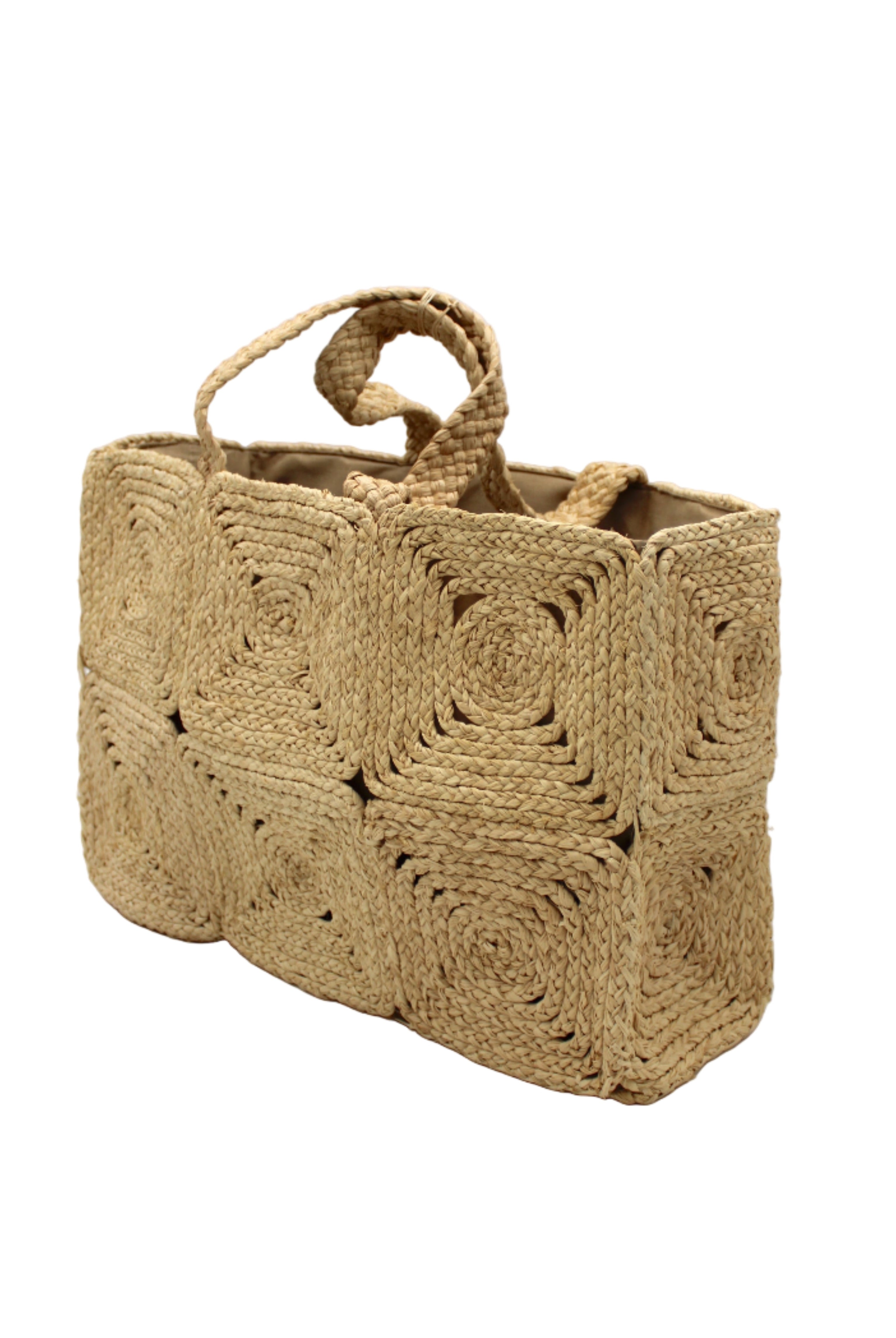 Side view Gemma Crochet Disc Rectangle Large Straw Basket Handbag handmade braided natural raffia palm fiber in a solid hue of Natural straw color with subtle square disc pattern around the outside of the bag in two horizontal bands of squares creating a geometric pattern and matching woven handles beach bag purse - Shebobo