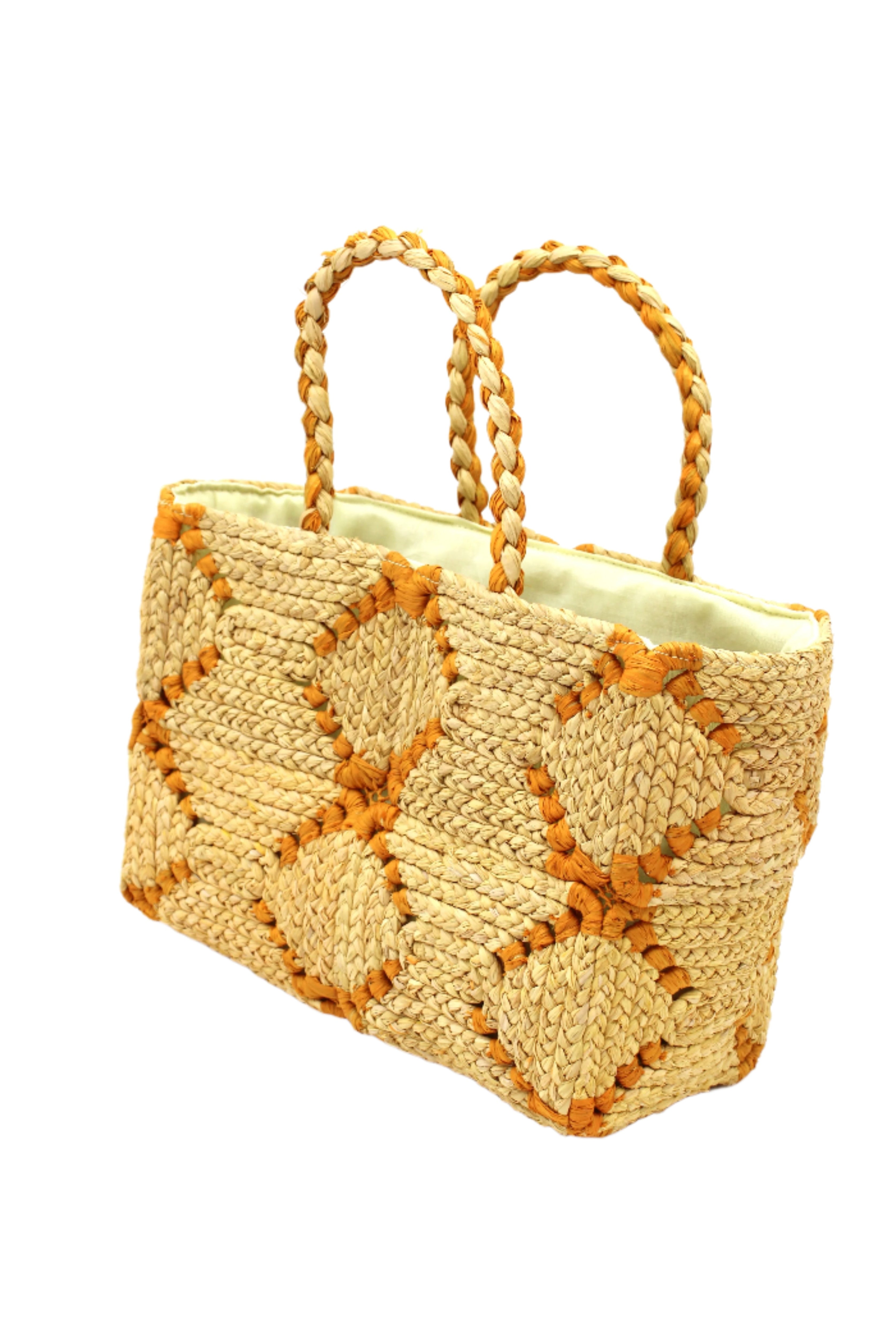 Side view Gemma Crochet Disc Rectangle Butter and Saffron Straw Basket Handbag handmade woven raffia palm fiber in a two tone multicolor pattern of butter light yellow and saffron yellow/orange create a coiled braid disc pattern result in a star pattern around the bag with matching woven handles top handle bag - Shebobo