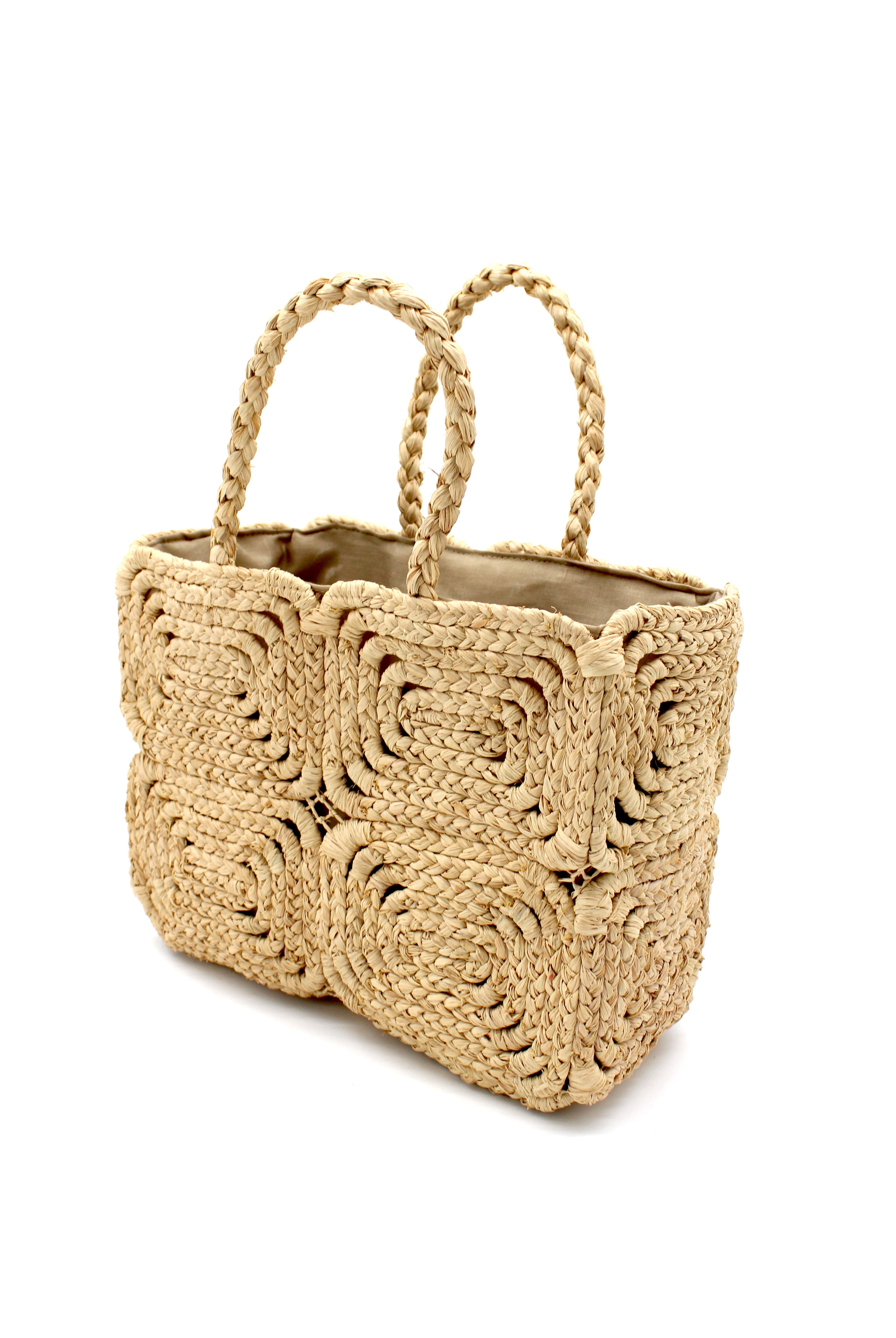 Side View Gemma Crochet Disc Rectangle Natural Straw Basket Handbag handmade woven raffia palm fiber in a solid hued pattern of natural straw color create a coiled braid disc pattern result in a star pattern around the bag with matching woven handles top handle bag - Shebobo