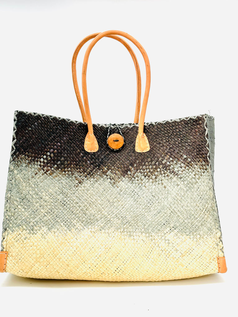 Holden Black Ombre Zafran Large Straw Beach Bags handmade dip dyed raffia woven into a three part horizontal ombre pattern of black on the top, grey in the middle and both sides, and natural on the bottom with cross stitch edging, wooden button, and leather handles - Shebobo