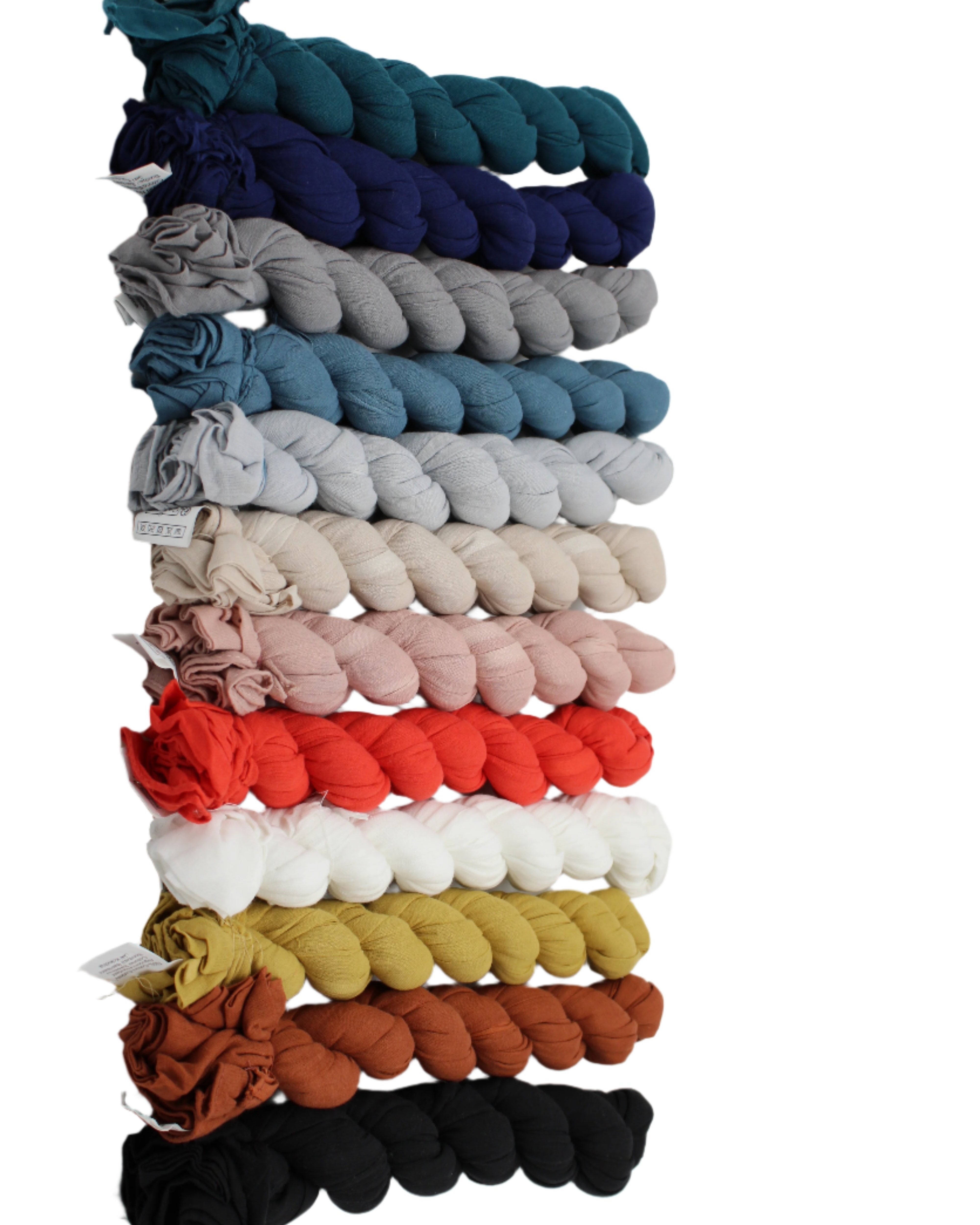 Isla Solid Color Cotton Scarf Wrap showing all color ways of teal, dusk blue, grey, denim blue, sky, natural, rose petal, coral, white, cumin, whisky, and black - Shebobo