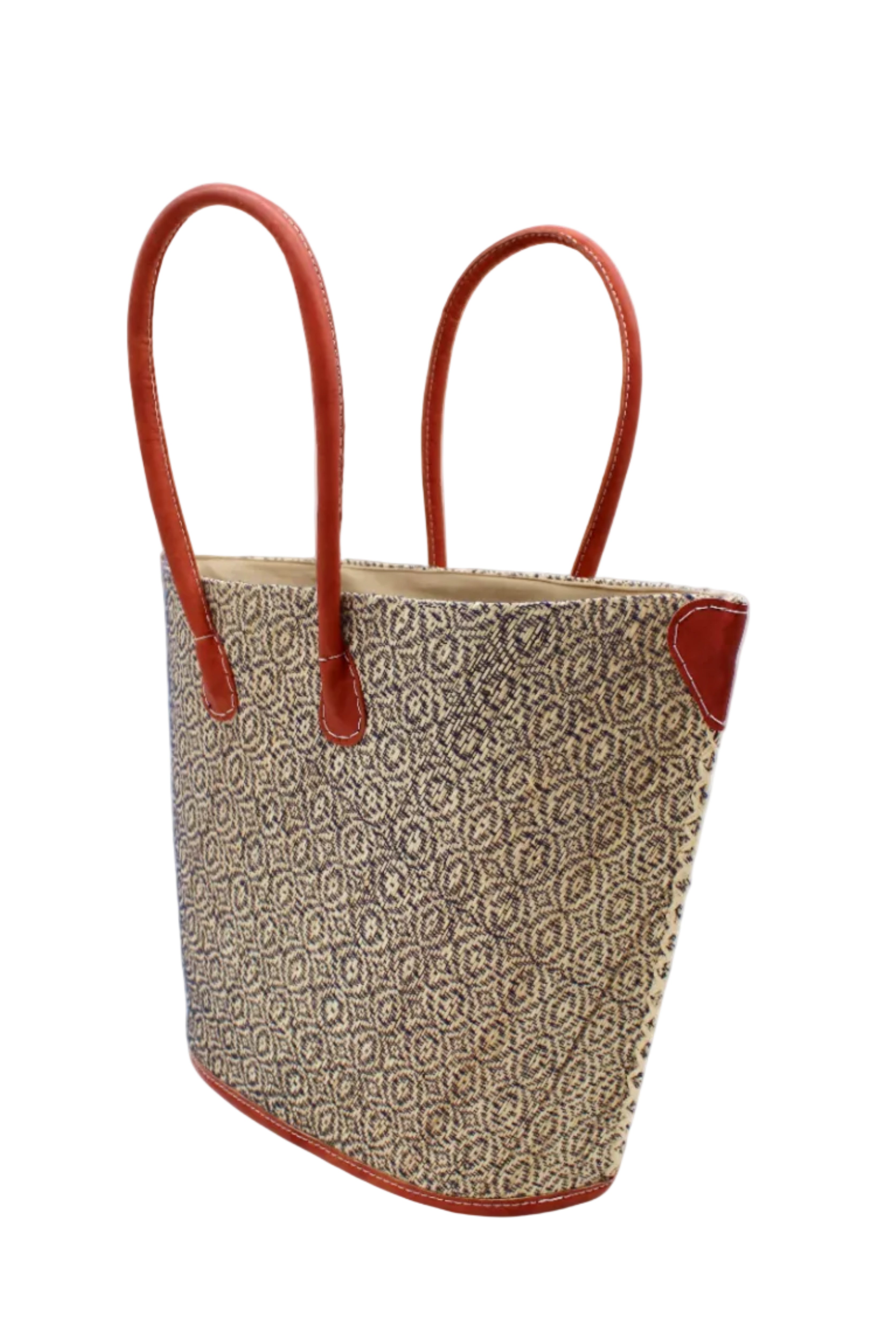 Side view Josephine Woven Small Straw Tote Bag handmade natural raffia palm fiber in natural straw color woven with contrasting Black thread stitching in a subtle diagonal stripe pattern consisting of bands of ovals and circles with natural cross-stitch edge and leather handles beach bag shoulder bag - Shebobo