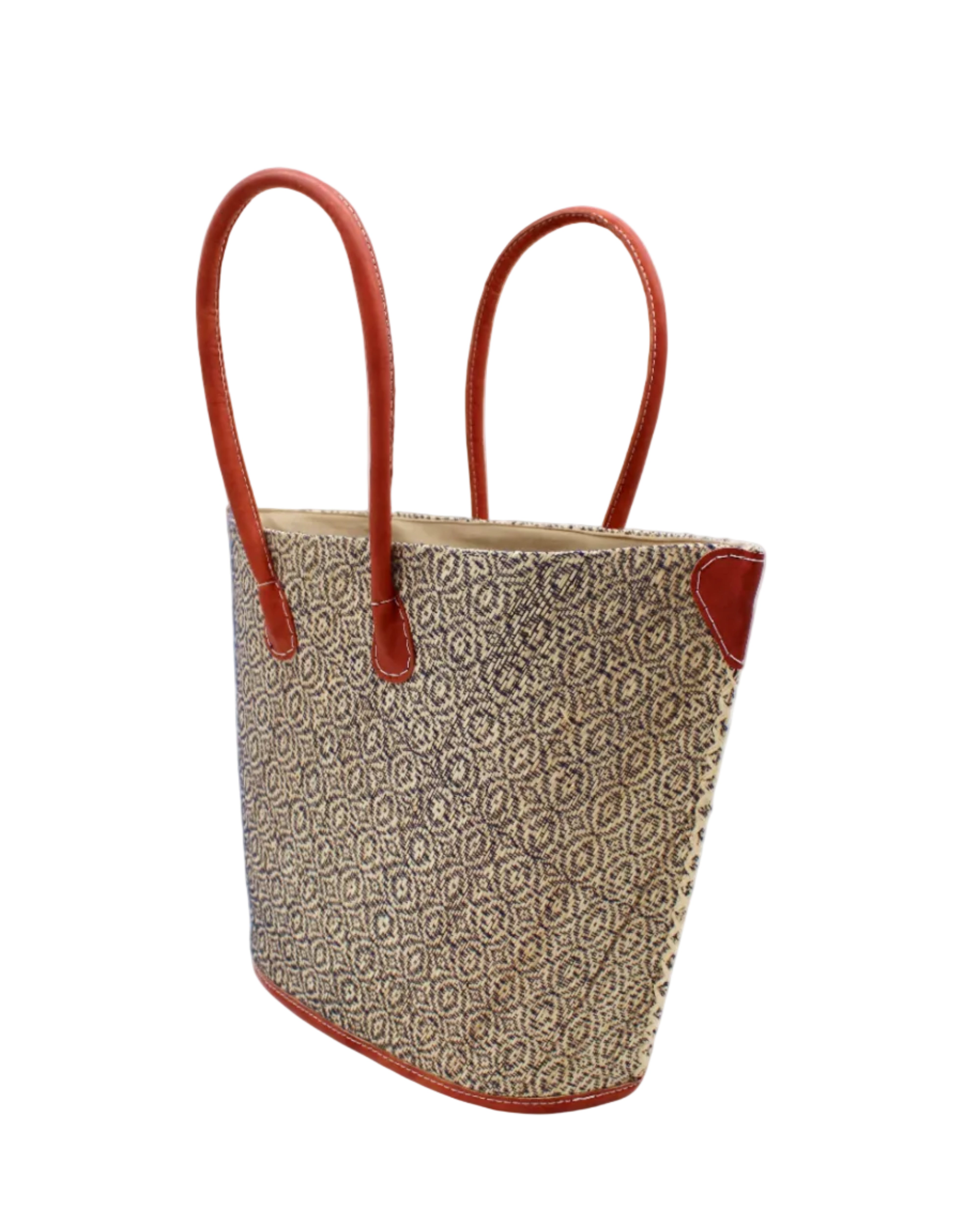 Side view Josephine Woven Small Straw Tote Bag handmade natural raffia palm fiber in natural straw color woven with contrasting Black thread stitching in a subtle diagonal stripe pattern consisting of bands of ovals and circles with natural cross-stitch edge and leather handles beach bag shoulder bag - Shebobo
