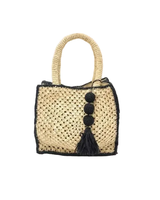 Kimba handmade crochet two tone handbag purse natural straw color with black trim and crochet cascading balls plus tassel bag charm embellishment - Shebobo