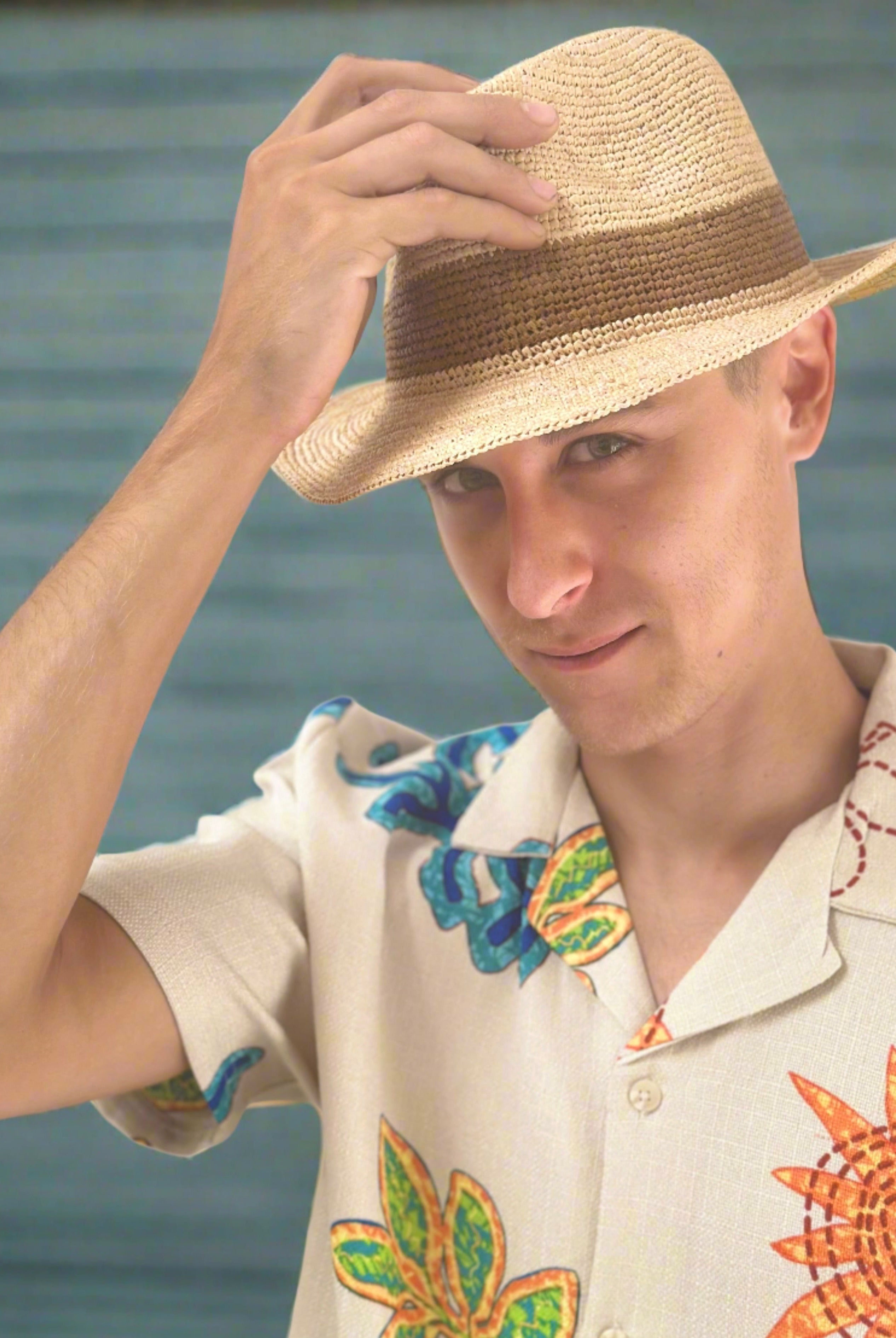 Model wearing Kelly Crochet Fedora - Unisex Straw Sun Hats handmade woven natural raffia palm fiber in a solid hue of natural straw color with woven in hatband of cinnamon/tobacco/brown - Shebobo