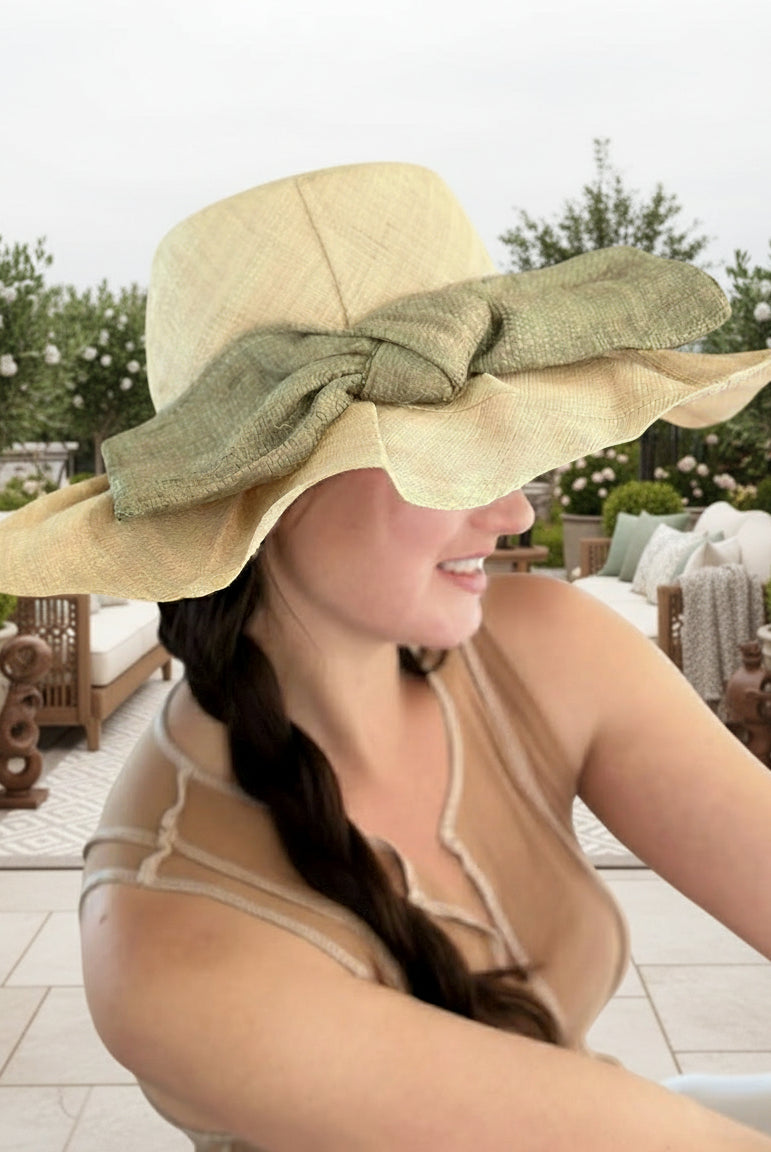 Model wearing Lilly 5" Brim Fan Straw Sun Hat with Big Ocean Mist/sage/green bow and matching hatband on handmade natural loomed raffia pleated wide brim hat - Shebobo