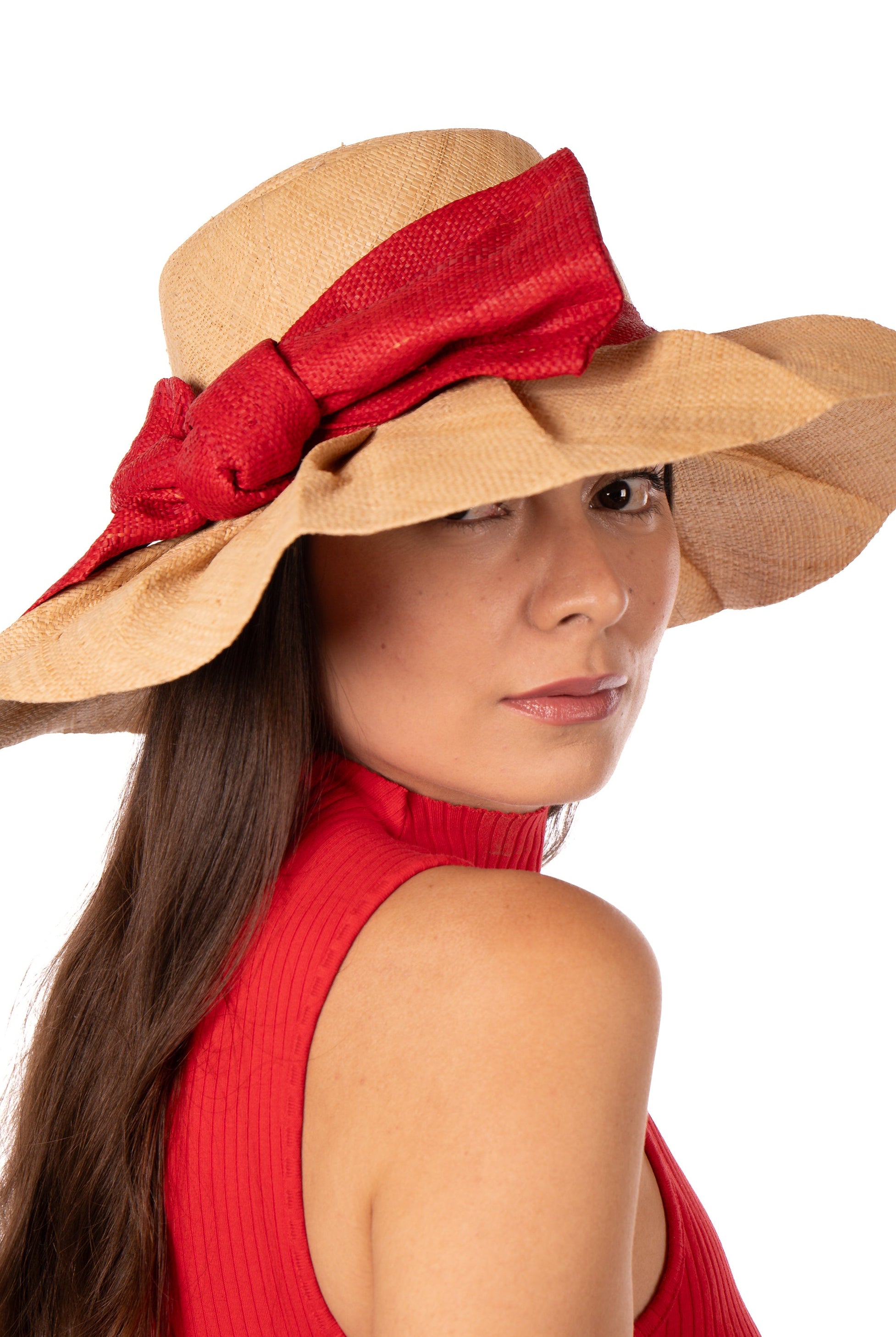 Model wearing Lilly 5" Brim Fan Straw Sun Hat with Big Red bow and matching hatband on handmade natural loomed raffia pleated wide brim hat - Shebobo