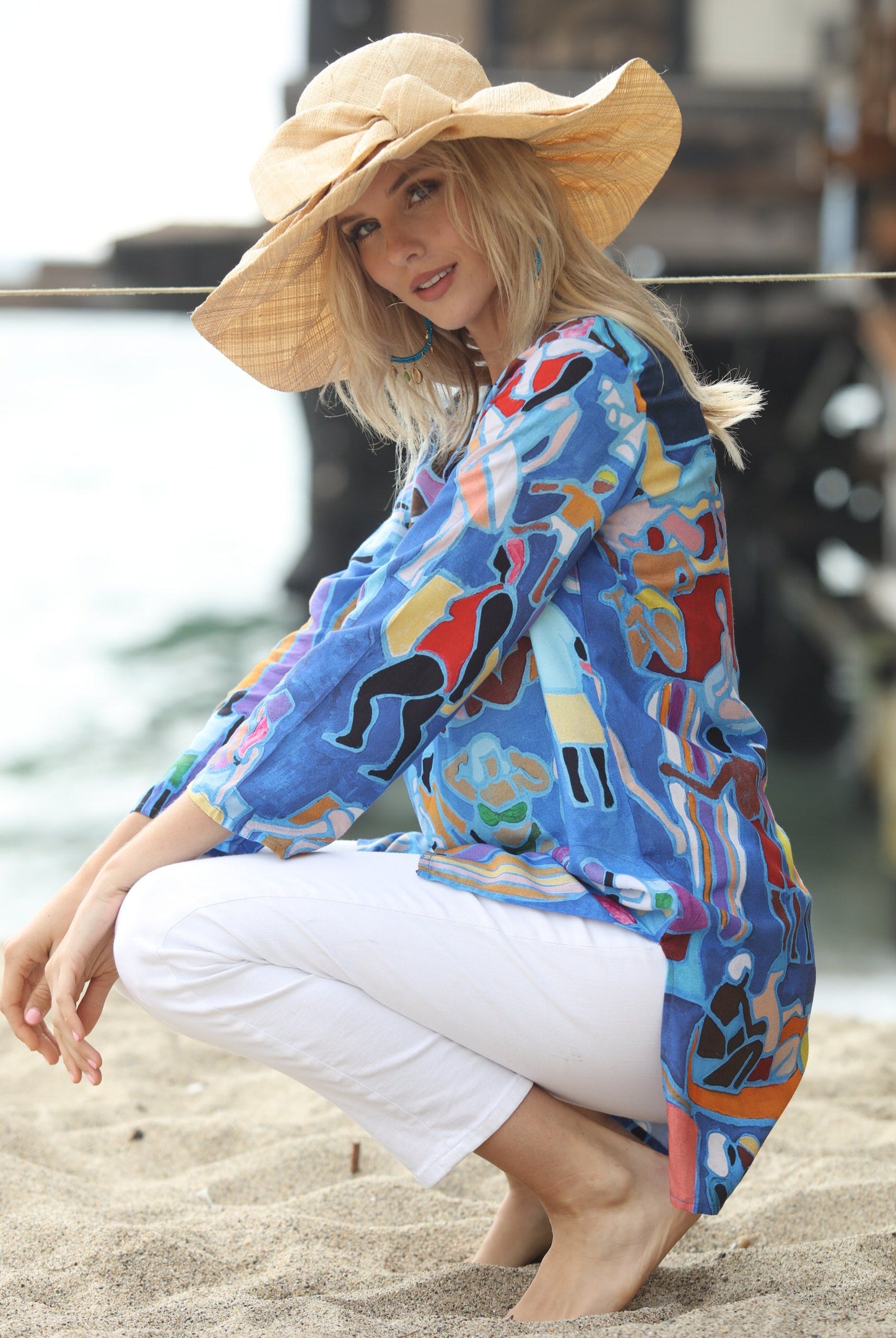 Model wearing Lilly 5" Brim Fan Straw Sun Hat with Big natural straw colored bow and matching hatband on handmade natural loomed raffia pleated wide brim hat - Shebobo