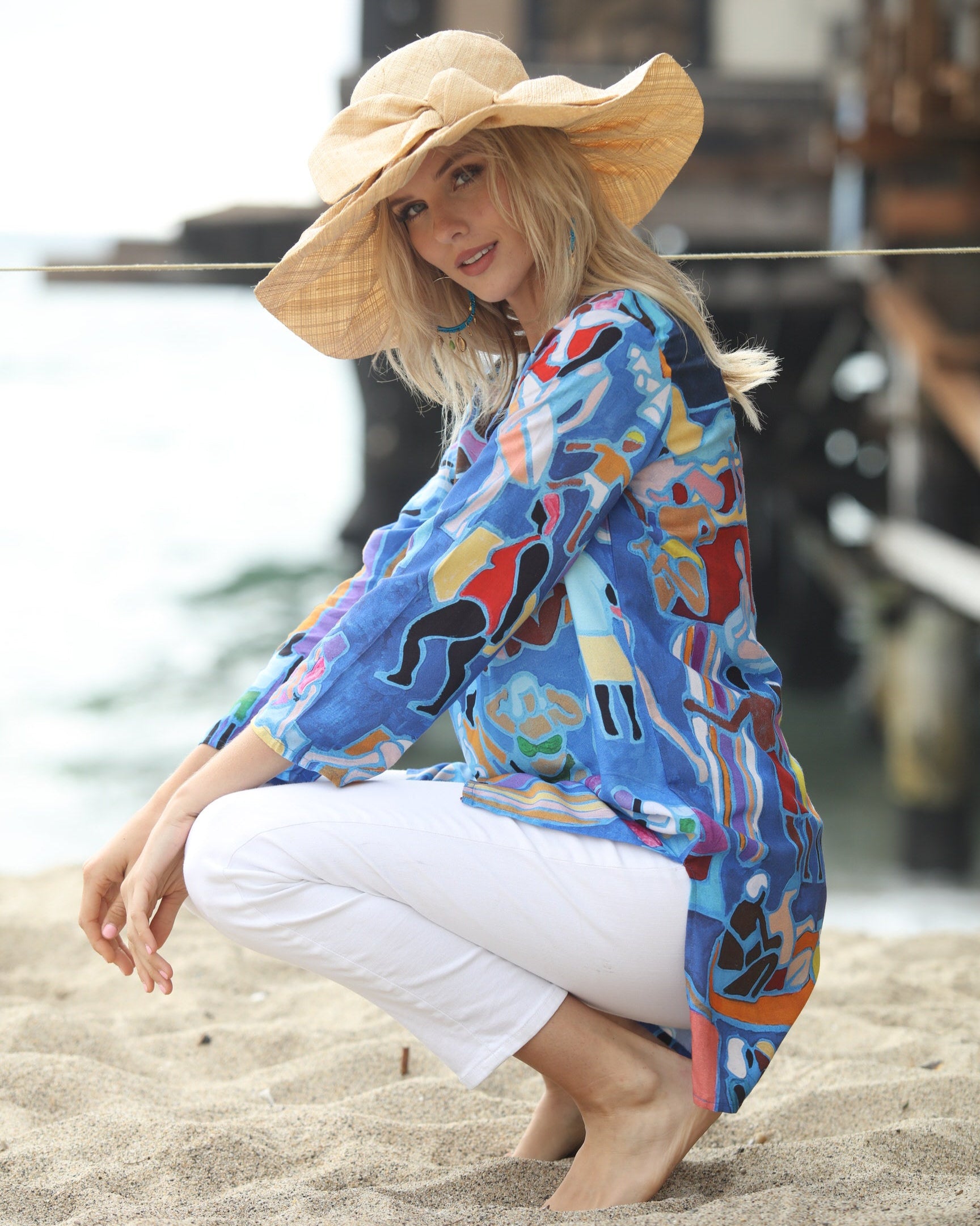 Model wearing Lilly 5" Brim Fan Straw Sun Hat with Big natural straw colored bow and matching hatband on handmade natural loomed raffia pleated wide brim hat - Shebobo