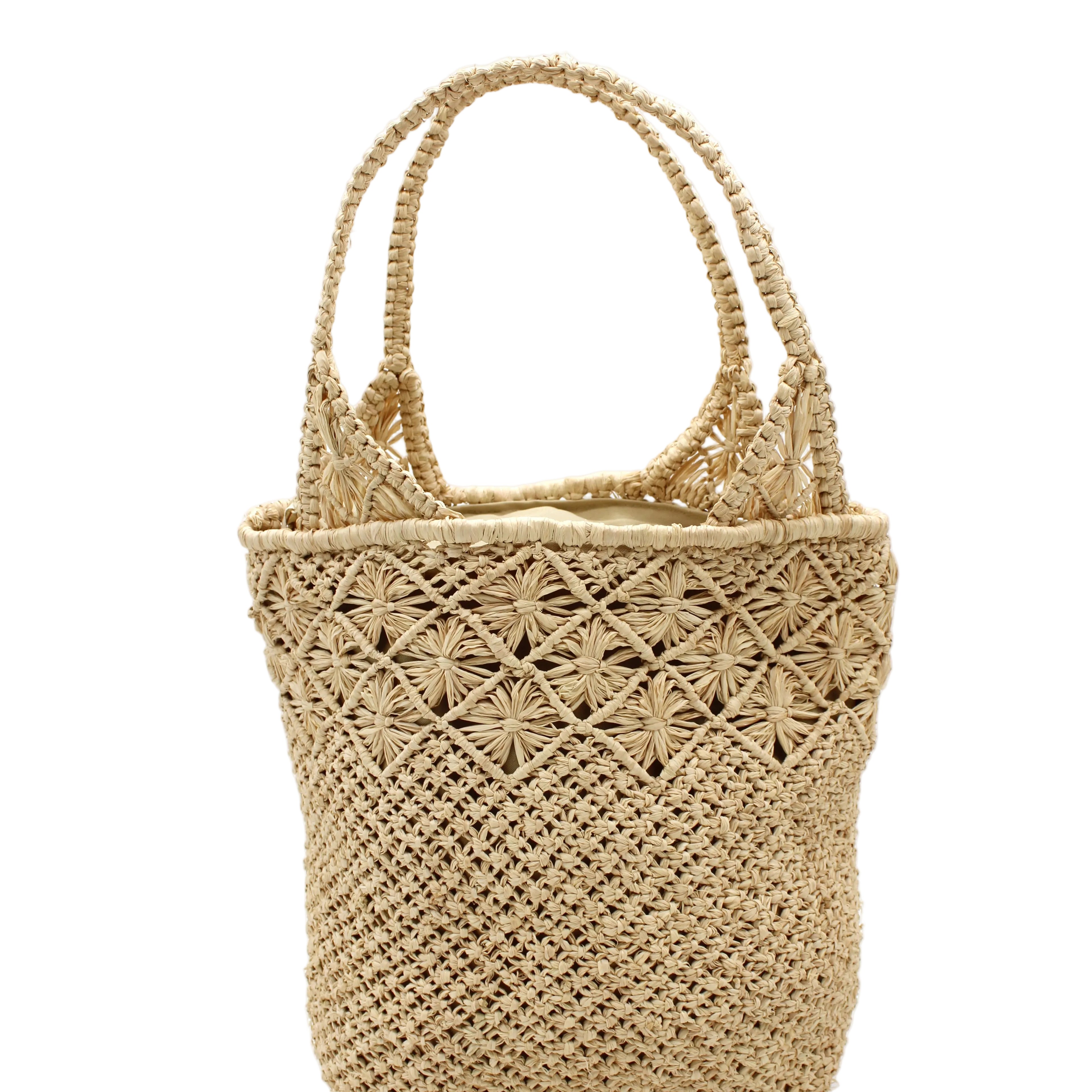 Luca Macrame Diamonds Crochet Straw Handbag handmade knotted natural raffia palm fiber in a solid hue of Natural straw color in a multi-texture circular pattern of concentric spiral links on the base, cross-hatch x pattern up 2/3rds of the bag, and geometric diamond flower pattern around the top third, with diamond pattern on the base of the shoulder strap handles with tubular loop handle tops - Shebobo