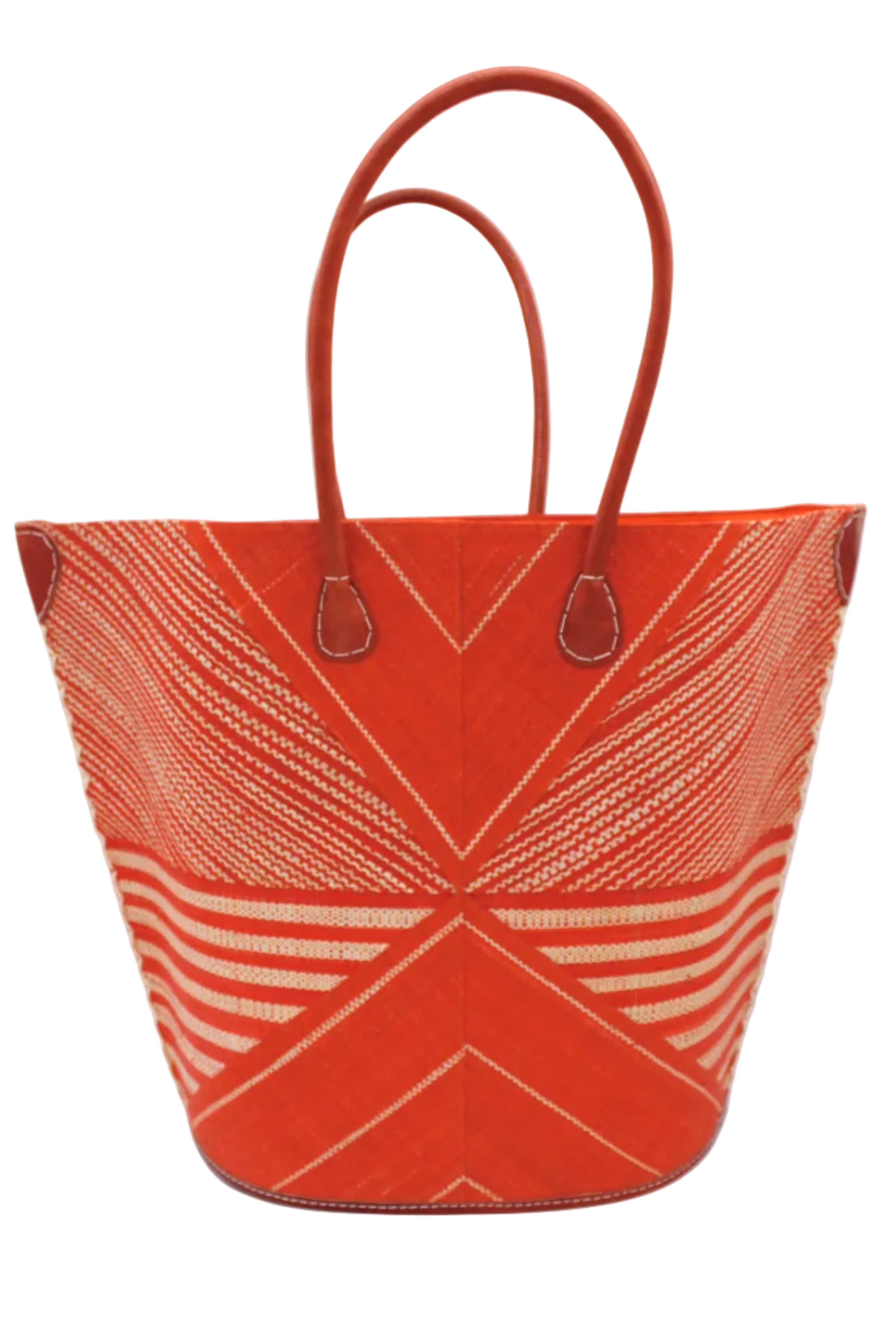 Mariposa Large Straw Tote Bag handmade loomed natural raffia palm fiber in a multi paneled pattern design of pinstripe, melange, and wide stripe combinations geometrically radiating from the center point of the bag outwards in a two tone color combination of Coral orange/red and natural straw color with a solid hue of color on the back of the bag plus leather handles and embellishments shoulder bag - Shebobo