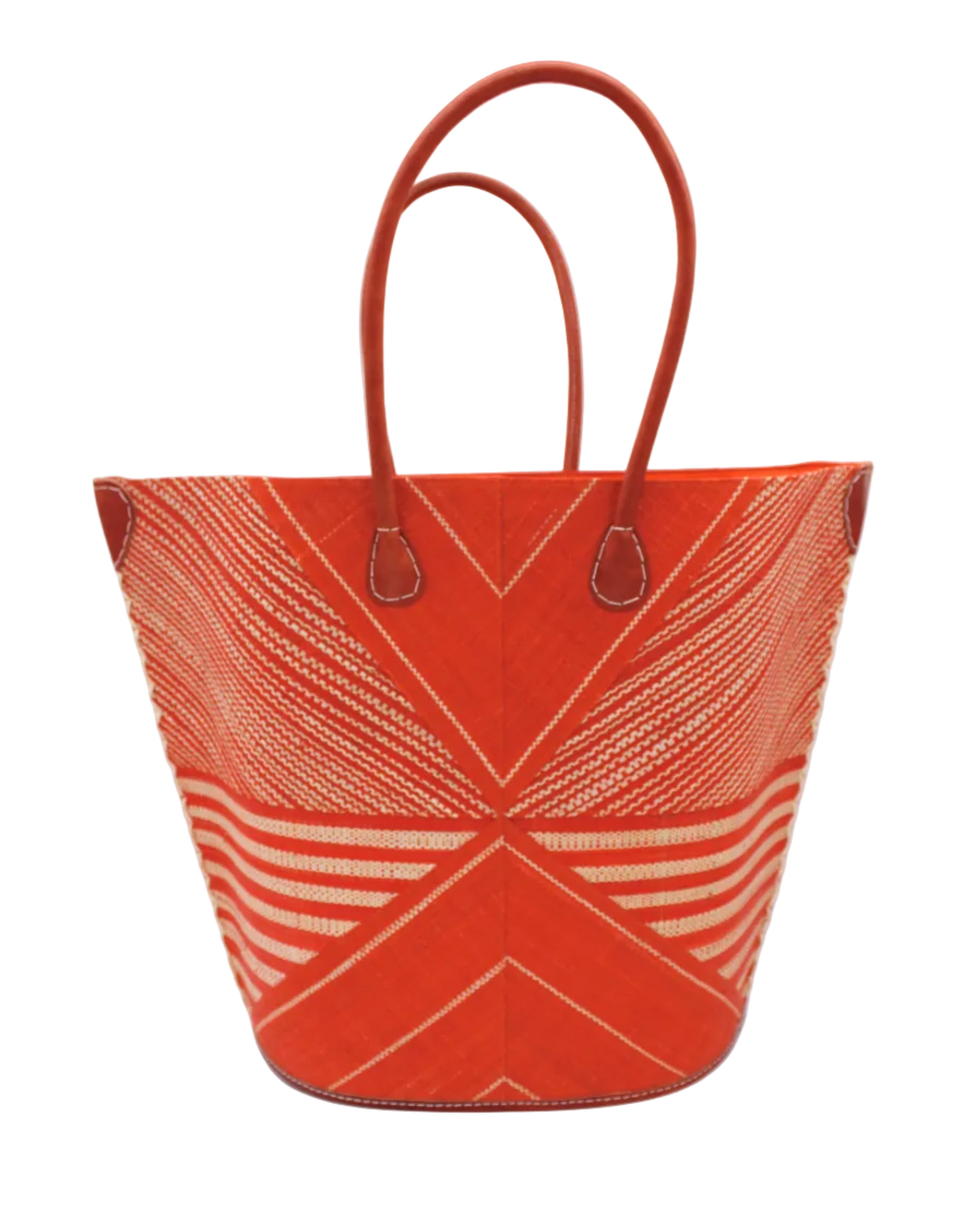Mariposa Large Straw Tote Bag handmade loomed natural raffia palm fiber in a multi paneled pattern design of pinstripe, melange, and wide stripe combinations geometrically radiating from the center point of the bag outwards in a two tone color combination of Coral orange/red and natural straw color with a solid hue of color on the back of the bag plus leather handles and embellishments shoulder bag - Shebobo