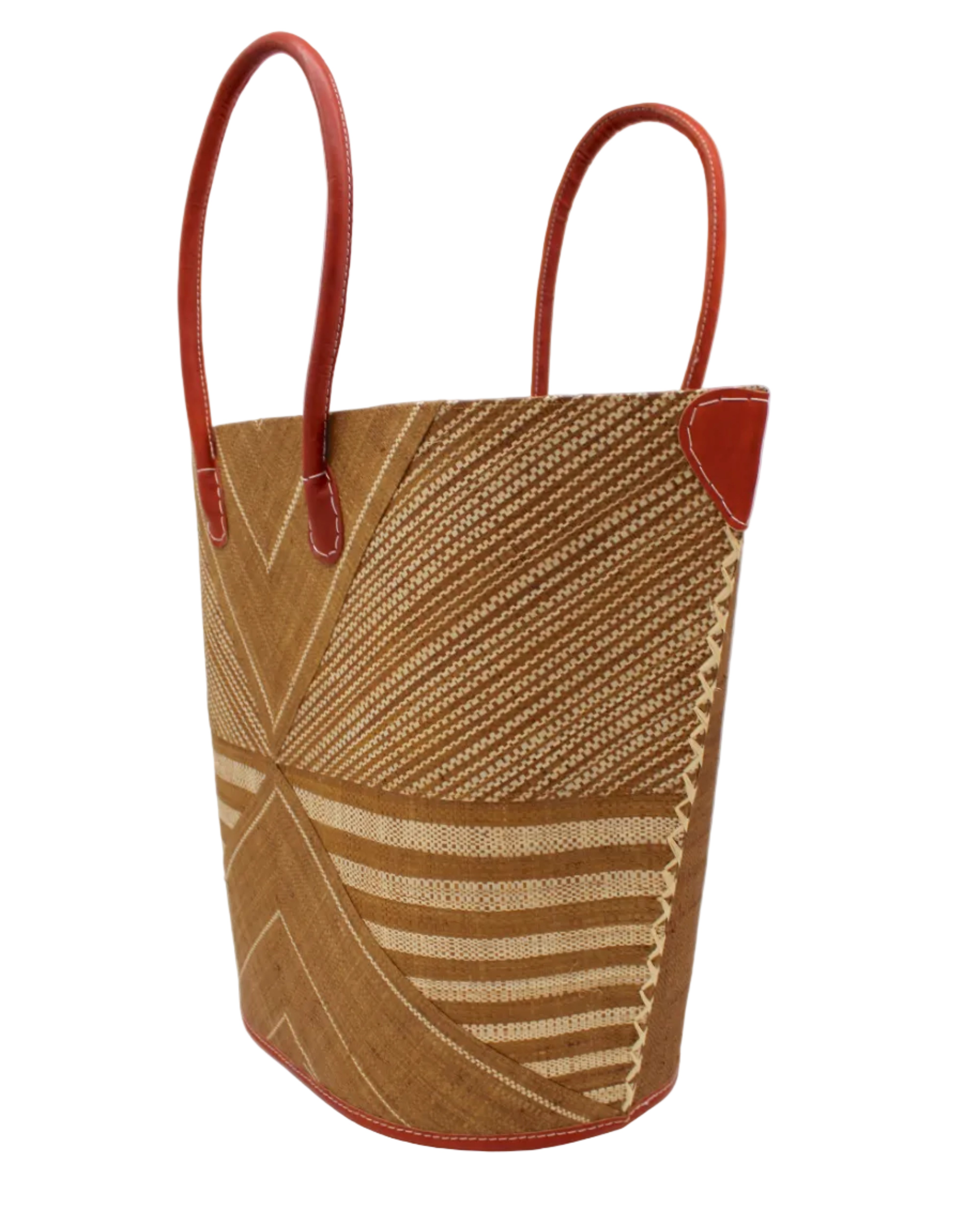 Side view Mariposa Large Straw Tote Bag handmade loomed natural raffia palm fiber in a multi paneled pattern design of pinstripe, melange, and wide stripe combinations geometrically radiating from the center point of the bag outwards in a two tone color combination of Tobacco cinnamon/dark/brown and natural straw color with a solid hue of color on the back of the bag plus leather handles and embellishments shoulder bag - Shebobo
