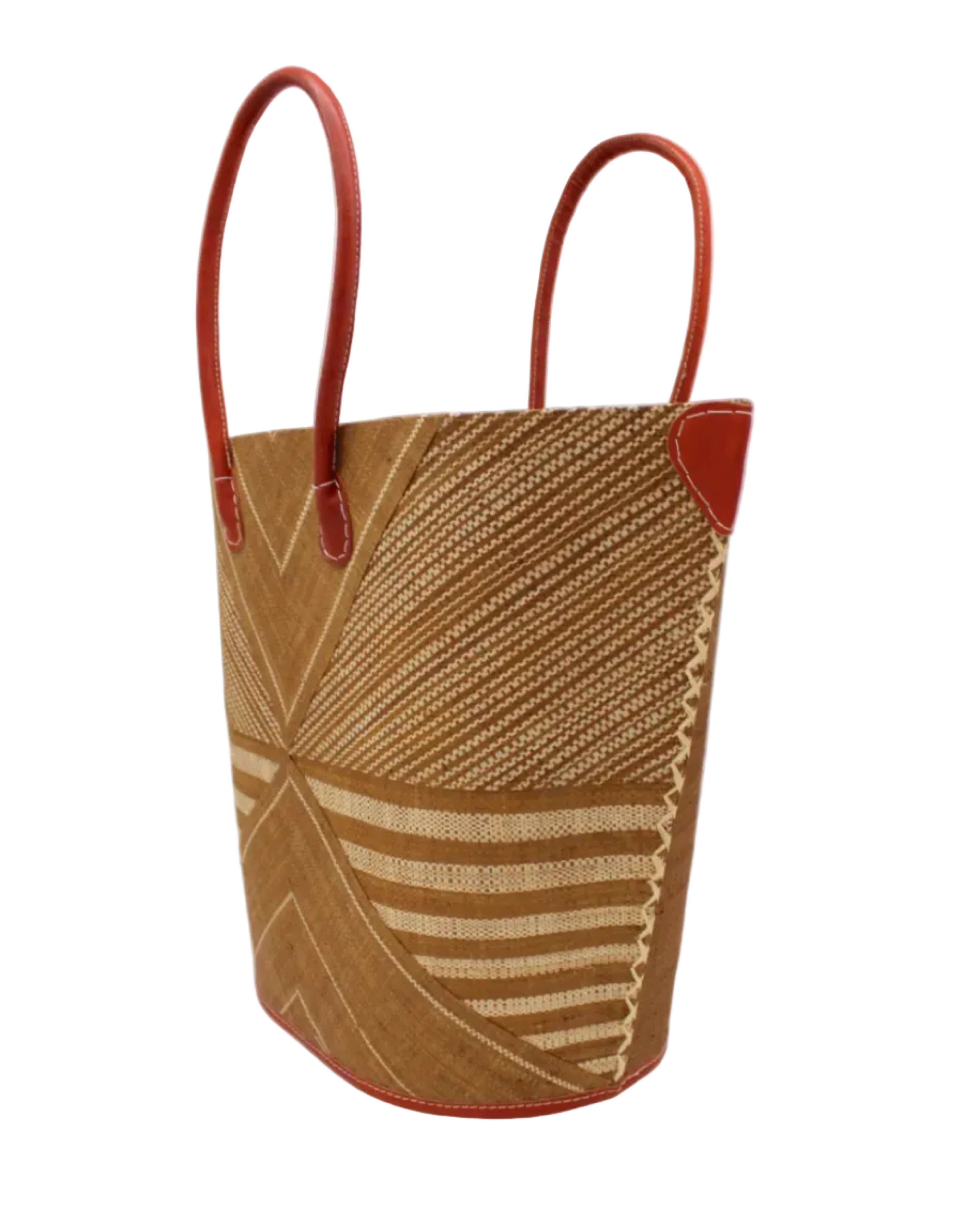 Side view Mariposa Large Straw Tote Bag handmade loomed natural raffia palm fiber in a multi paneled pattern design of pinstripe, melange, and wide stripe combinations geometrically radiating from the center point of the bag outwards in a two tone color combination of Tobacco cinnamon/dark/brown and natural straw color with a solid hue of color on the back of the bag plus leather handles and embellishments shoulder bag - Shebobo