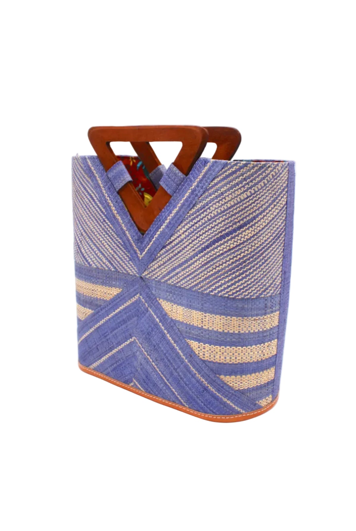 Side view Mariposa Zuki Raffia Straw Bucket Handbag with Wood Triangle Handles handmade loomed raffia palm fiber in a multi paneled pattern design of pinstripe, melange, and wide stripe combinations geometrically radiating from the center point of the bag outwards in a two tone color combination of Denim and Natural straw color with a solid hue of color on the back of the bag plus carved wooden handles purse - Shebobo