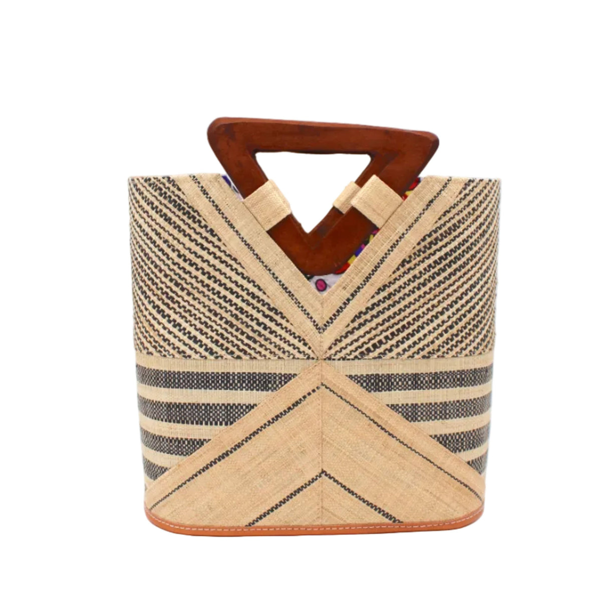 Mariposa Zuki Raffia Straw Bucket Handbag with Wood Triangle Handles handmade loomed raffia palm fiber in a multi paneled pattern design of pinstripe, melange, and wide stripe combinations geometrically radiating from the center point of the bag outwards in a two tone color combination of Natural straw color and black with a solid hue of color on the back of the bag plus carved wooden handles purse - Shebobo
