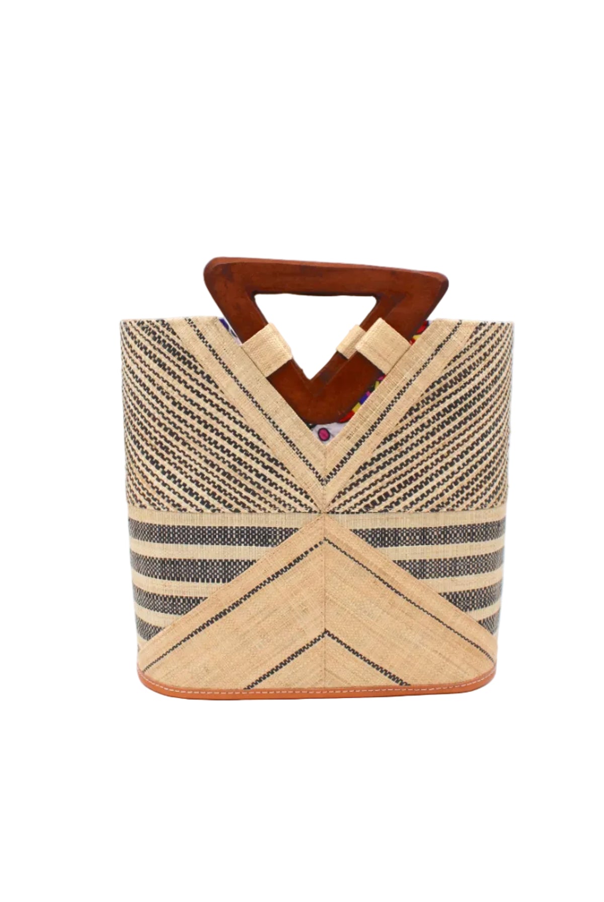 Mariposa Zuki Raffia Straw Bucket Handbag with Wood Triangle Handles handmade loomed raffia palm fiber in a multi paneled pattern design of pinstripe, melange, and wide stripe combinations geometrically radiating from the center point of the bag outwards in a two tone color combination of Natural straw color and black with a solid hue of color on the back of the bag plus carved wooden handles purse - Shebobo
