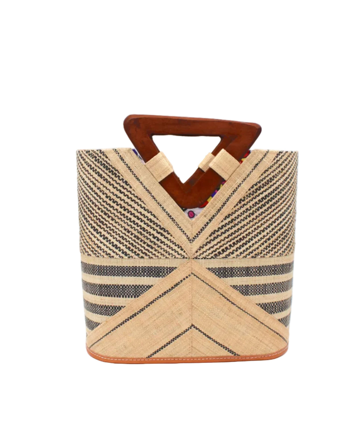 Mariposa Zuki Raffia Straw Bucket Handbag with Wood Triangle Handles handmade loomed raffia palm fiber in a multi paneled pattern design of pinstripe, melange, and wide stripe combinations geometrically radiating from the center point of the bag outwards in a two tone color combination of Natural straw color and black with a solid hue of color on the back of the bag plus carved wooden handles purse - Shebobo