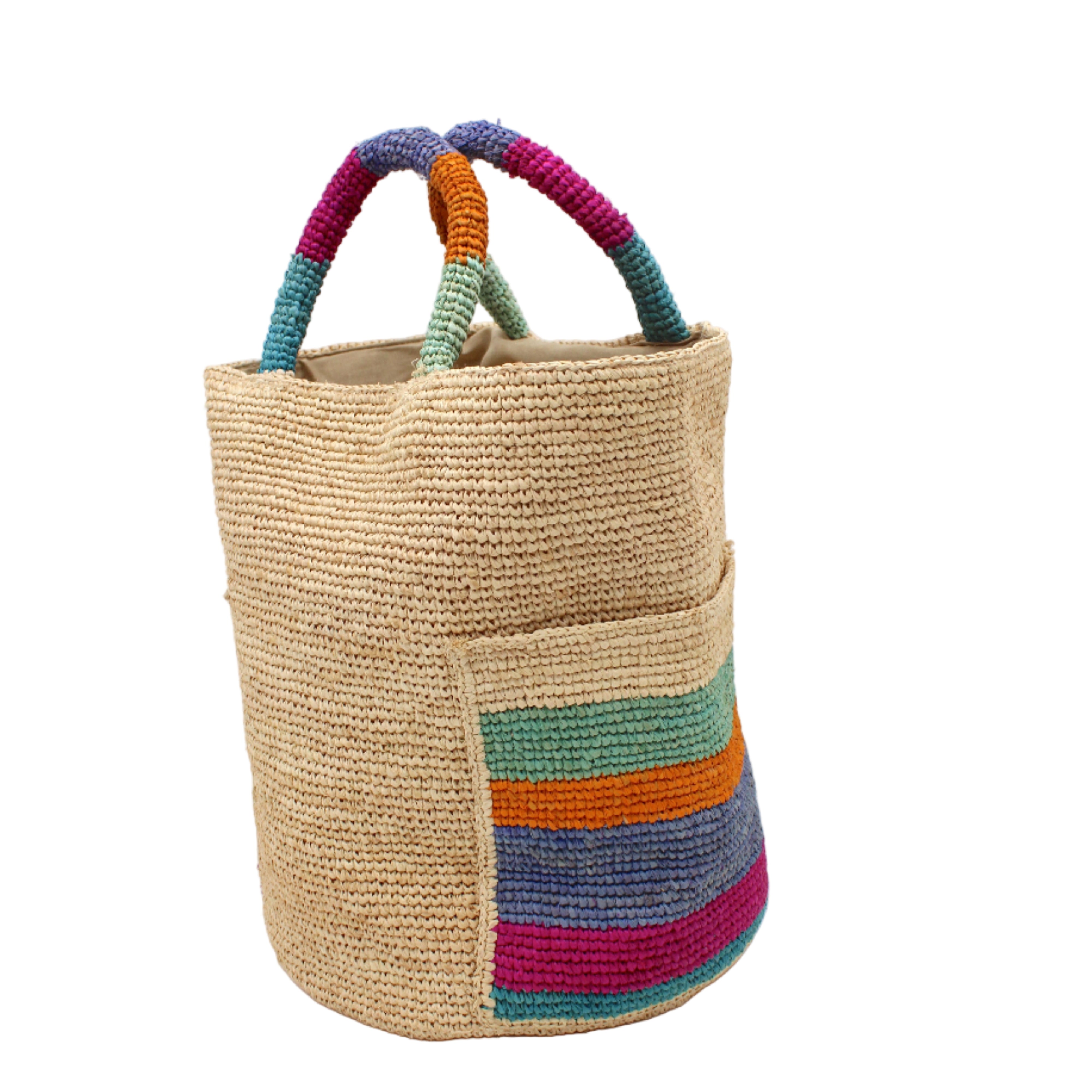 Side view Milos Caribbean Stripes Crochet Straw Basket Handbag with Pockets handmade natural raffia palm fiber in a solid hue of natural straw color on the body of the bag with multicolor wide stripe pattern of turquoise blue/green, fuchsia hot/bright/barbie/pink, denim retro/light/blue, saffron yellow/orange, and seafoam light/blue/green on both handles as well as two large external pockets tote bag - Shebobo