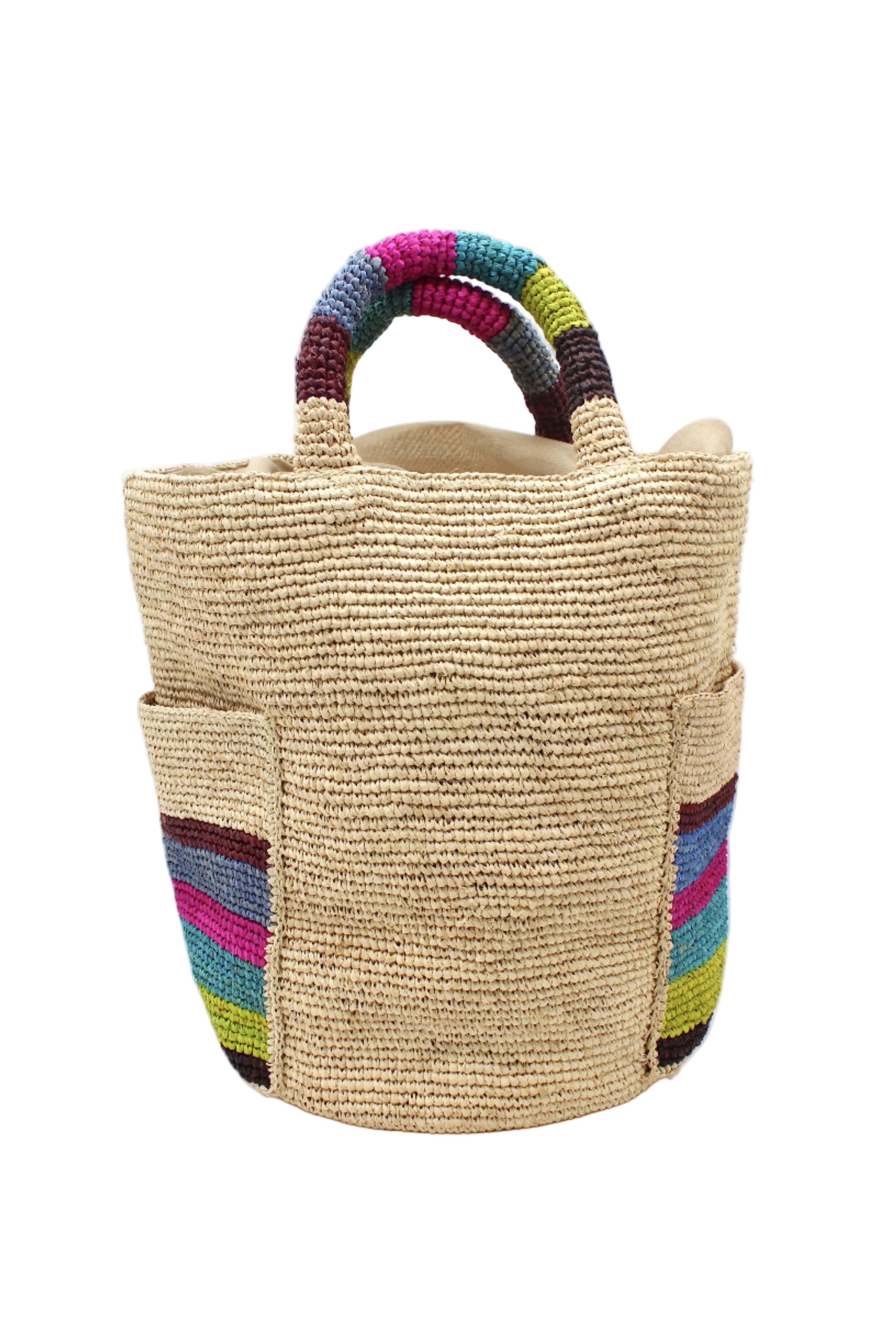Milos Riviera Stripes Crochet Straw Basket Handbag with Pockets handmade natural raffia palm fiber in a solid hue of natural straw color on the body of the bag with multicolor wide stripe pattern of umberwine bordeaux/claret/deep/dark/red/purple, denim retro/light/blue, fuchsia hot/bright/barbie/pink, teal dark/blue/green, midori lime/neon/green, and black on both handles as well as two large external pockets tote bag - Shebobo
