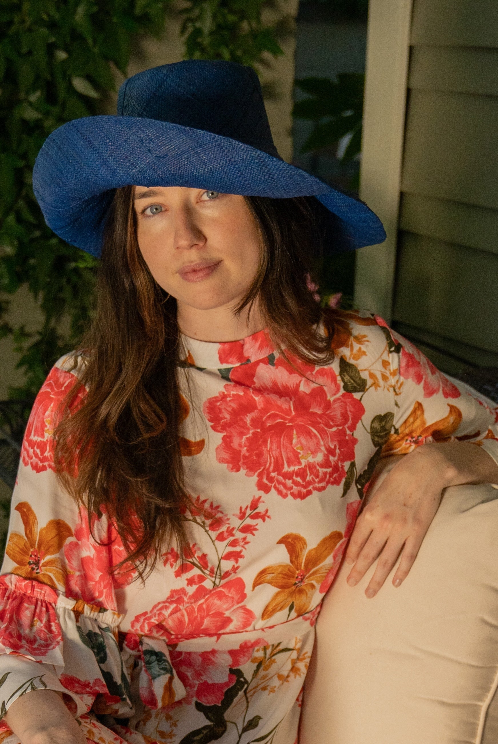 Model wearing Monica 5" Wide Brim Blue Packable Straw Sun Hat handmade loomed raffia in a solid hue of blue lightweight malleable flexible sun protection hat - Shebobo