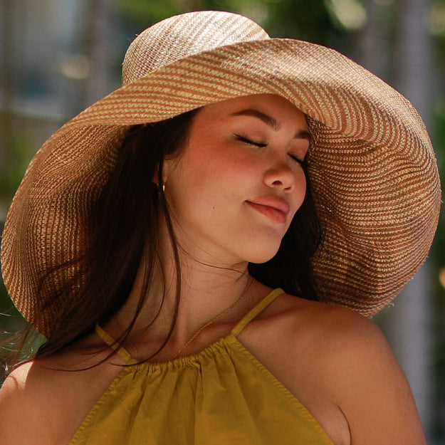 Model wearing 5 inch or 7 inch Wide Brim Cinnamon Two Tone Melange Packable Straw Sun Hat handmade loomed raffia in a multicolor heathered melange pattern of cinnamon/tobacco/brown and natural straw color creates a subtle swirl - Shebobo