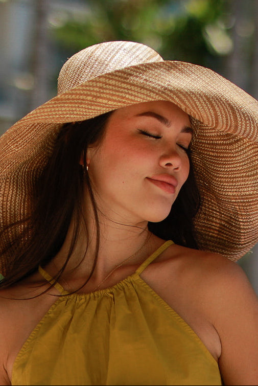 Model wearing 5 inch or 7 inch Wide Brim Cinnamon Two Tone Melange Packable Straw Sun Hat handmade loomed raffia in a multicolor heathered melange pattern of cinnamon/tobacco/brown and natural straw color creates a subtle swirl - Shebobo