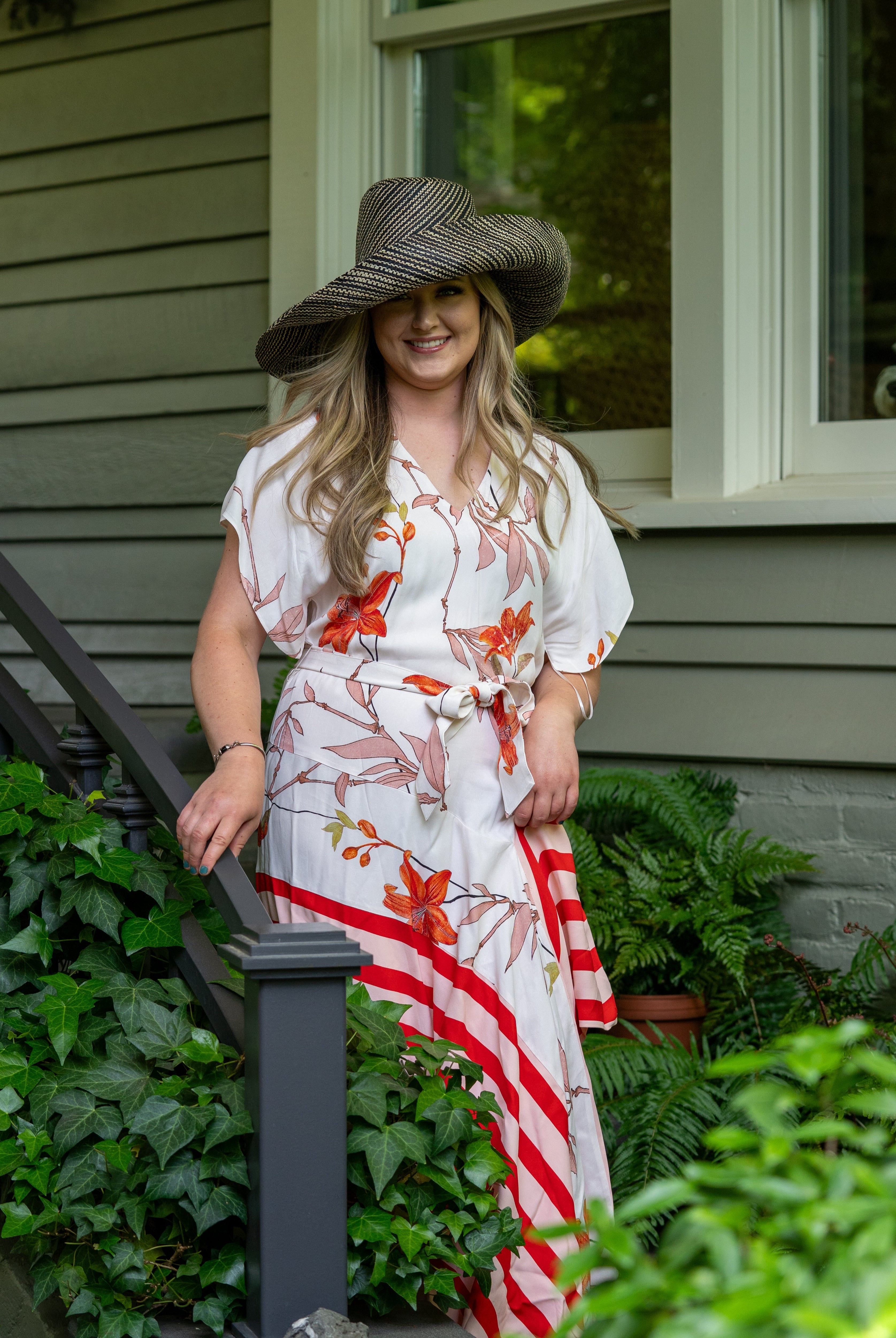 Model wearing Monica 7" Wide Brim Black Two Tone Melange Packable Straw Sun Hat handmade loomed raffia in a multicolor heathered melange pattern of black and natural straw color creates a subtle swirl - Shebobo