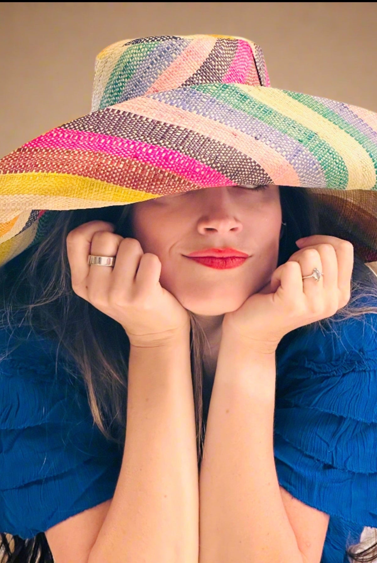 Model wearing Monica 7" Wide Brim Lollipop Multicolor Stripes Packable Straw Sun Hat Handmade loomed raffia in multi width bands of saffron yellow, fuchsia pink, turquoise blue, black, grass green, seafoam blue/green, pink, yellow, orange, blue, red, whiskey brown, natural straw color, etc. create a swirl pattern - Shebobo