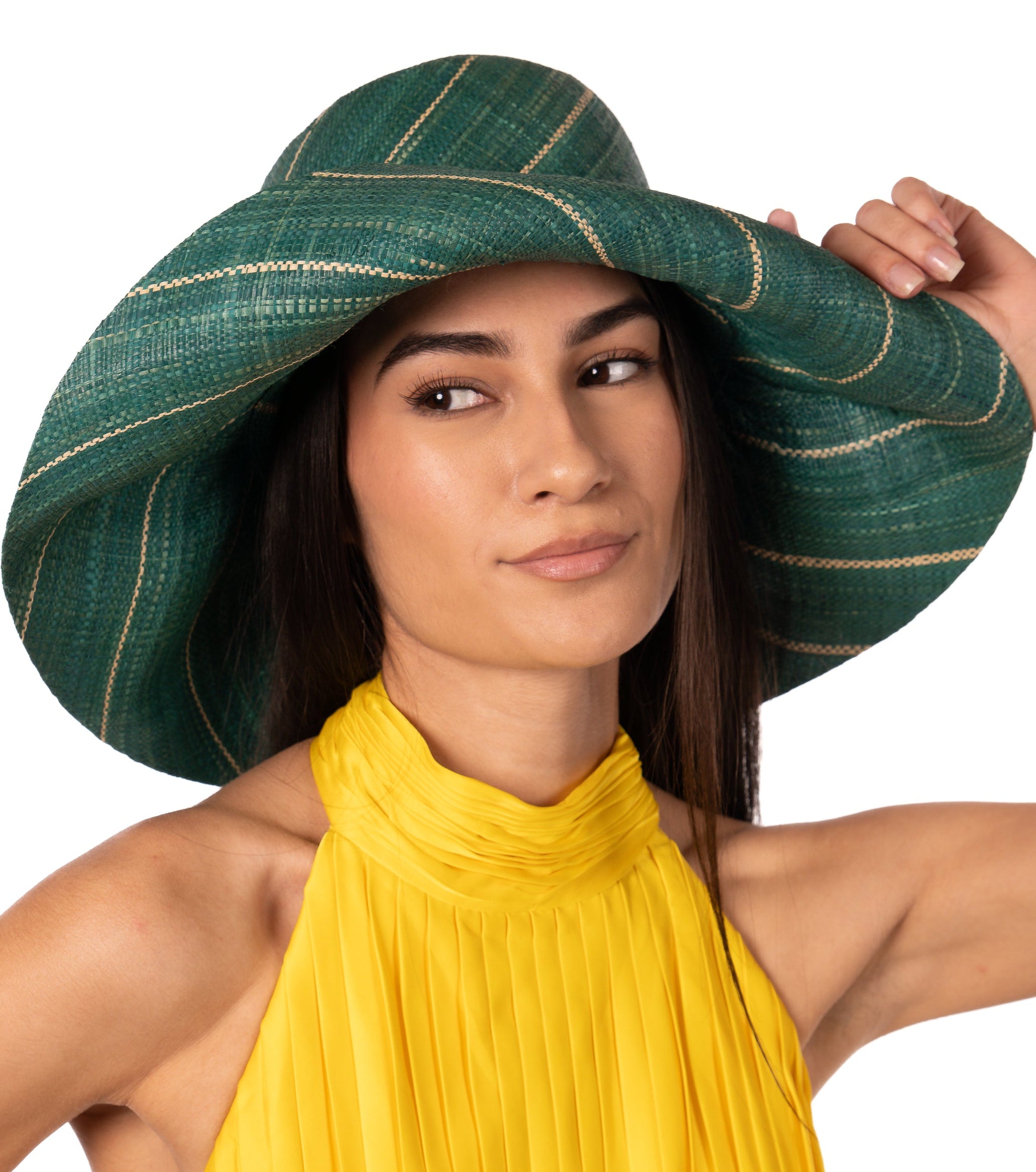 Model wearing Monica 5" Wide Brim Teal Pinstripes Packable Straw Sun Hat handmade loomed raffia in wide stripes of teal dark/green/blue with narrow stripes of natural creating a swirl pattern - Shebobo