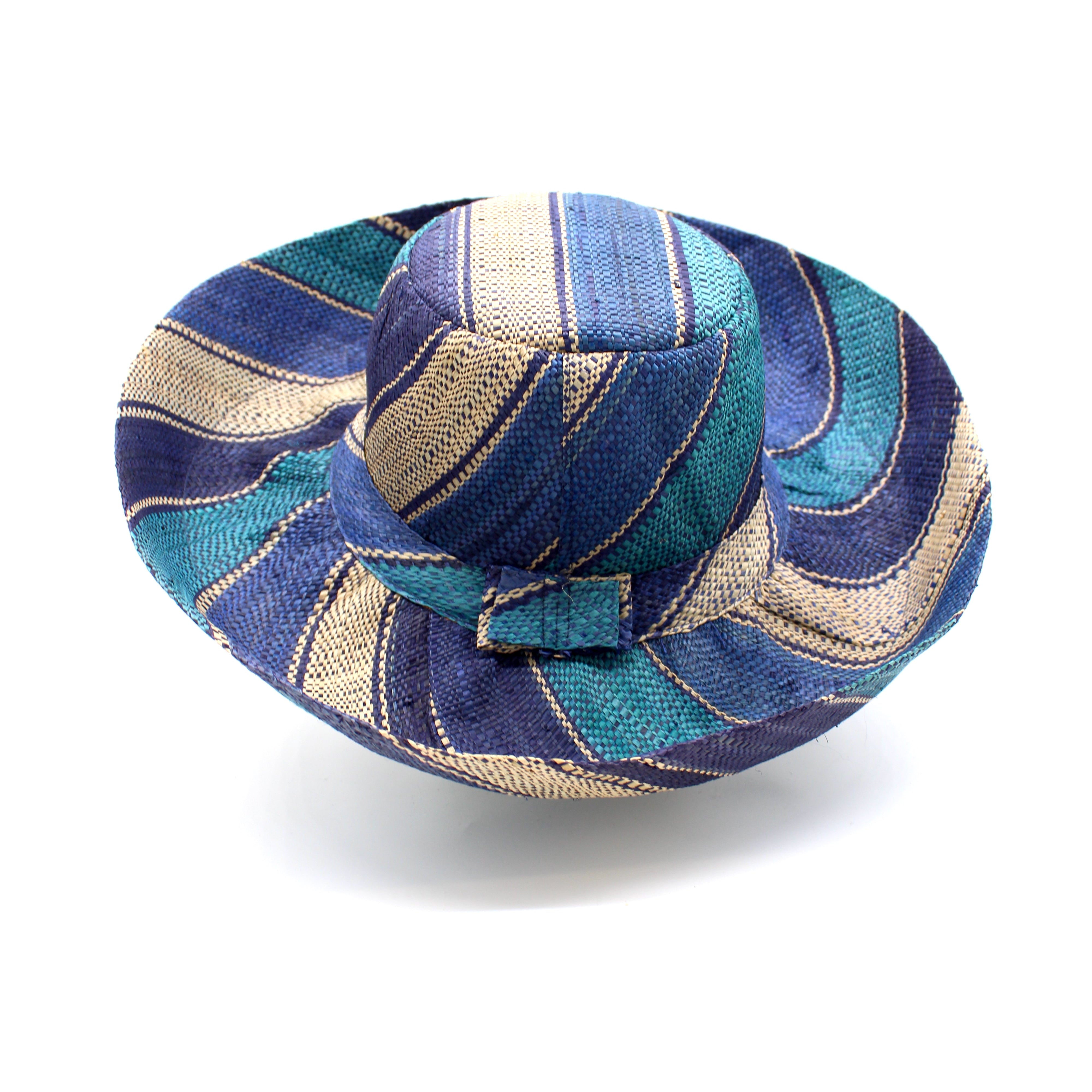 Monica 5" & 7" Wide Brim Blue Swirl Multicolor Stripe Pattern Packable Straw Sun Hat handmade loomed raffia in multi width bands of navy blue, turquoise blue, and natural straw color create a striped swirl pattern - Shebobo