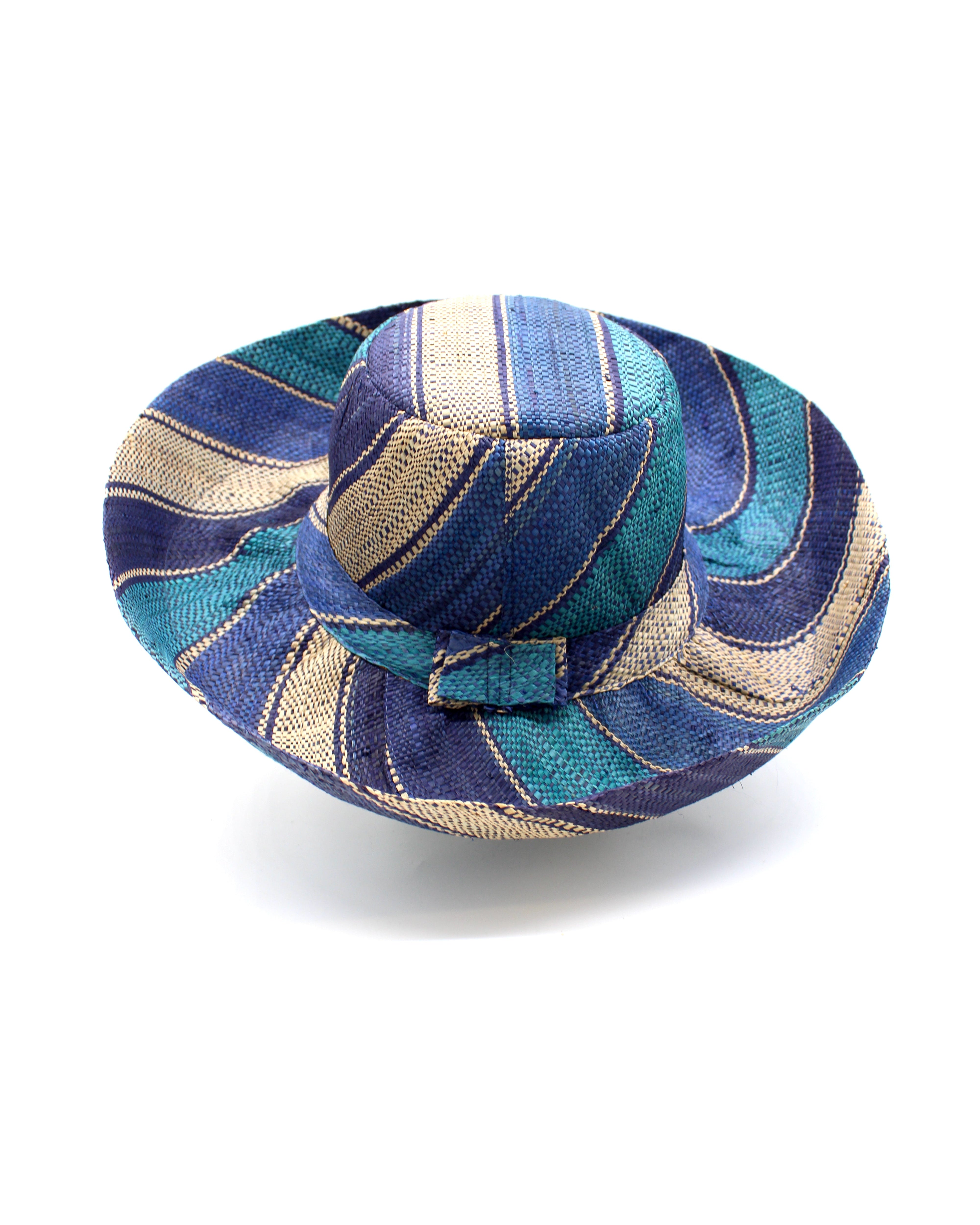 Monica 5" & 7" Wide Brim Blue Swirl Multicolor Stripe Pattern Packable Straw Sun Hat handmade loomed raffia in multi width bands of navy blue, turquoise blue, and natural straw color create a striped swirl pattern - Shebobo