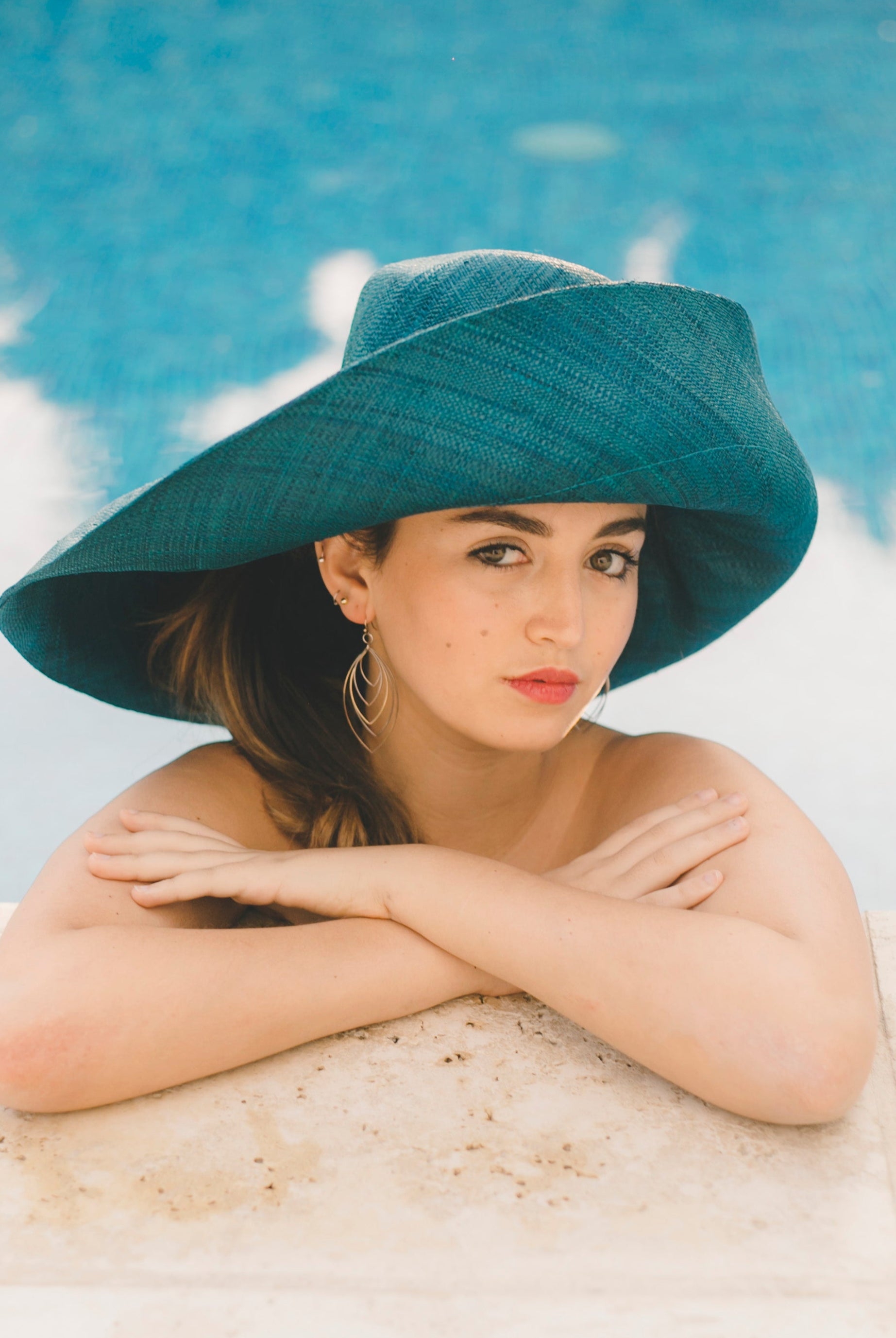 Model wearing Monica 7" wide brim teal dark/green/blue handmade loomed raffia packable lightweight straw sun hat - Shebobo